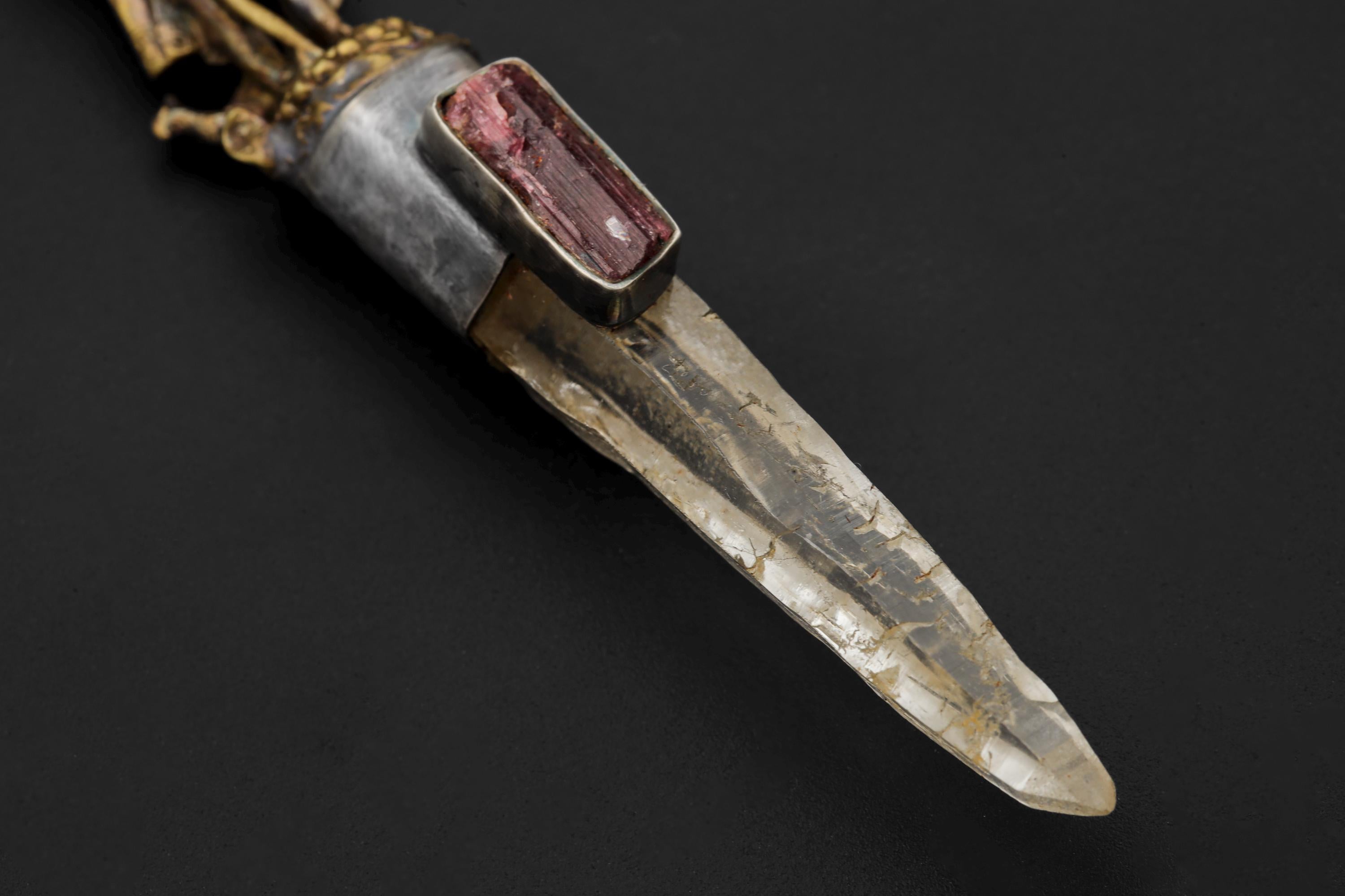 Macro of quartz termination highlighting internal clarity and faint inclusions.