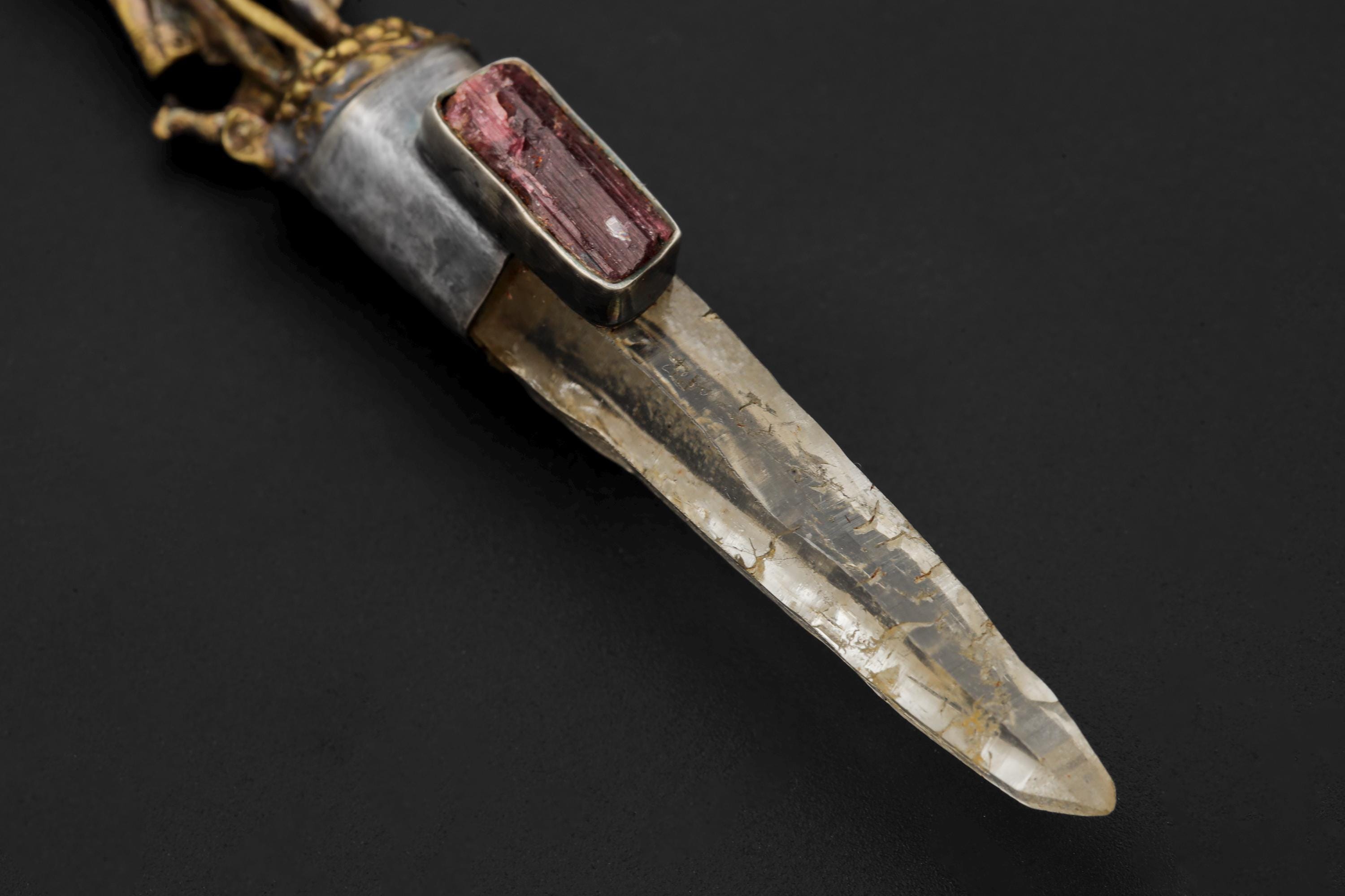 Macro of quartz termination highlighting internal clarity and faint inclusions.