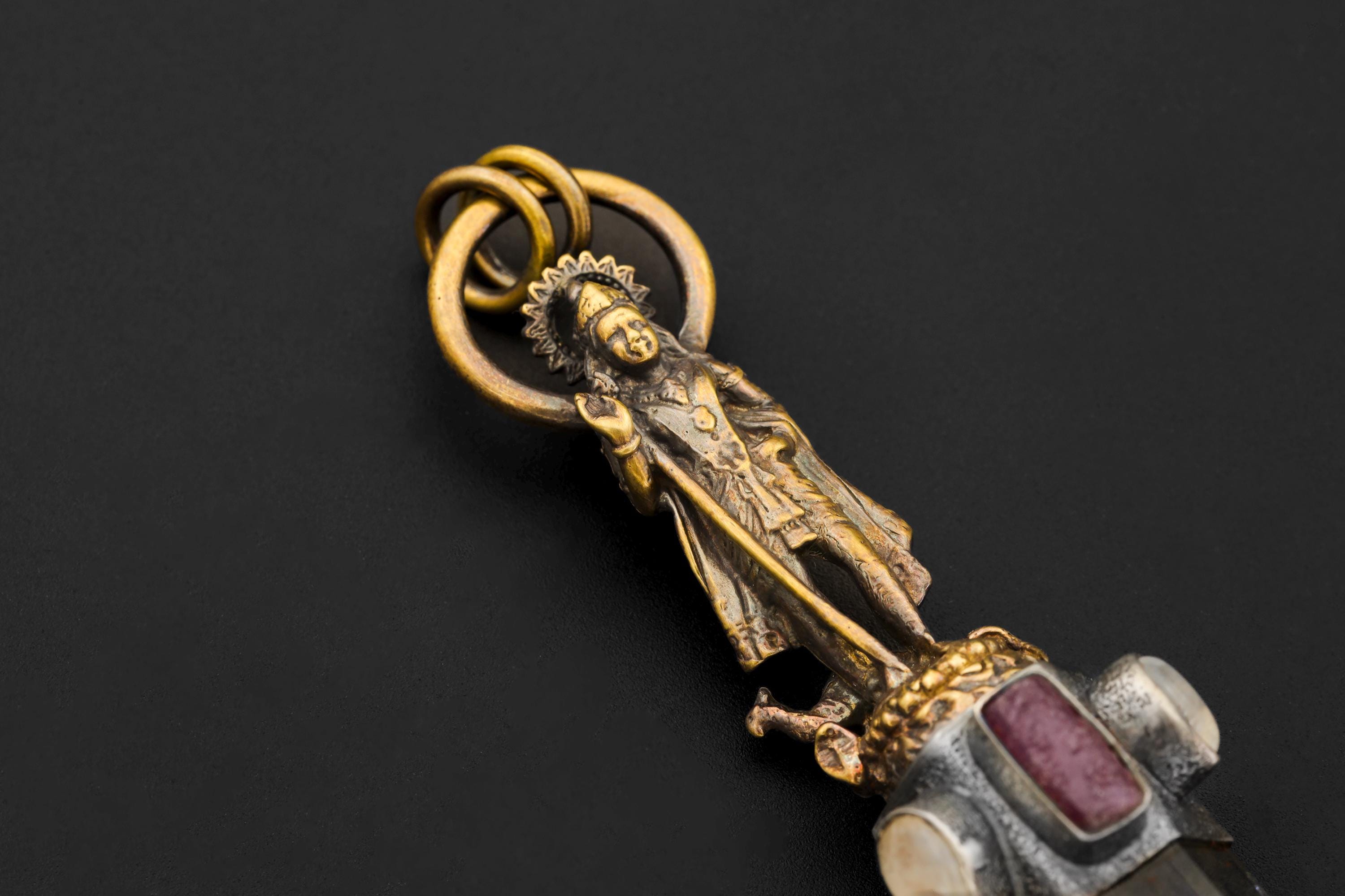 Close-up of Blue stone cabochon capturing natural iridescence and bezel craftsmanship.