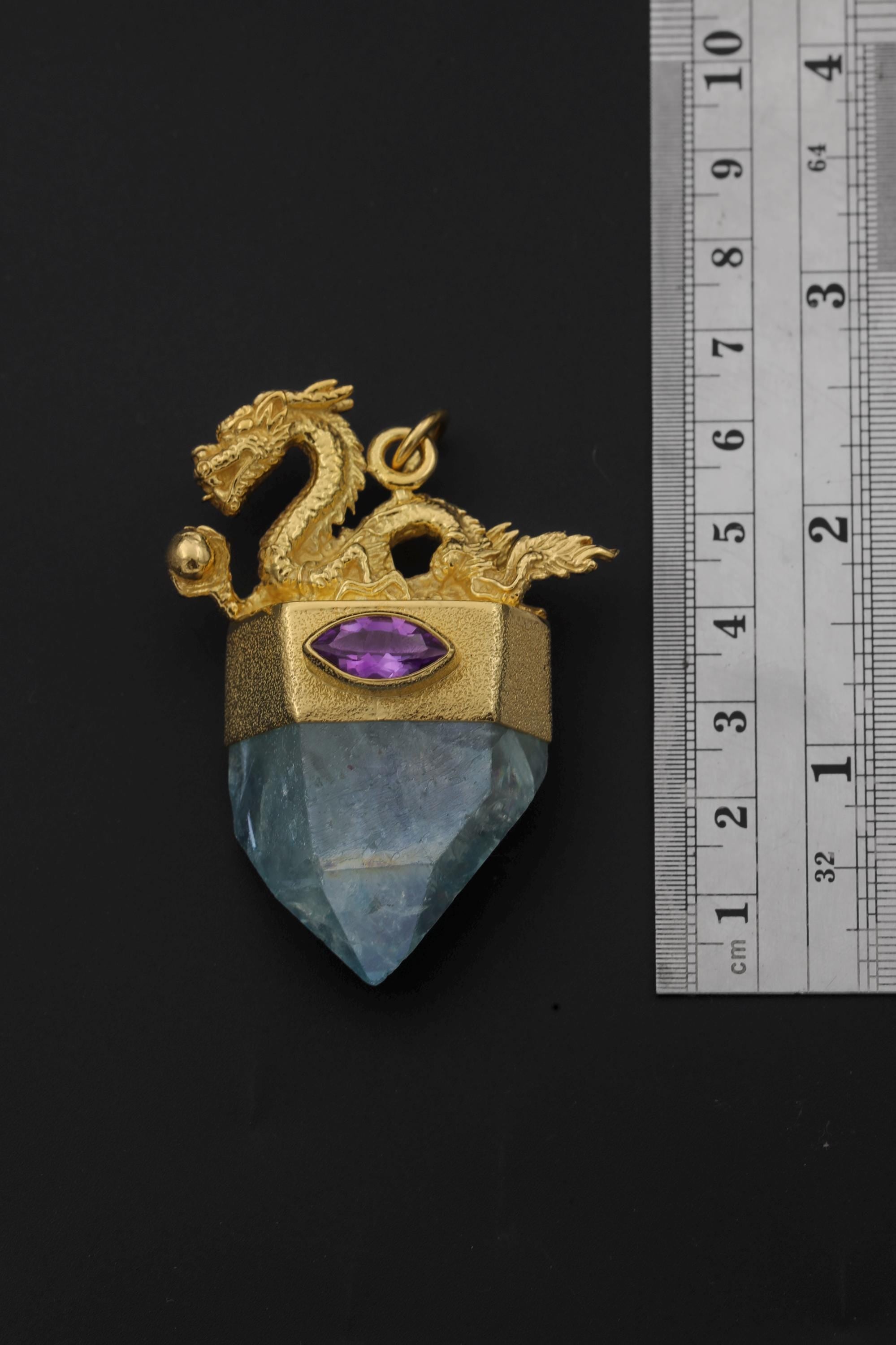Dragon Amethyst Aqua Aura Quartz pendant shown beside a ruler for scale, measuring approximately 5.4 cm long.