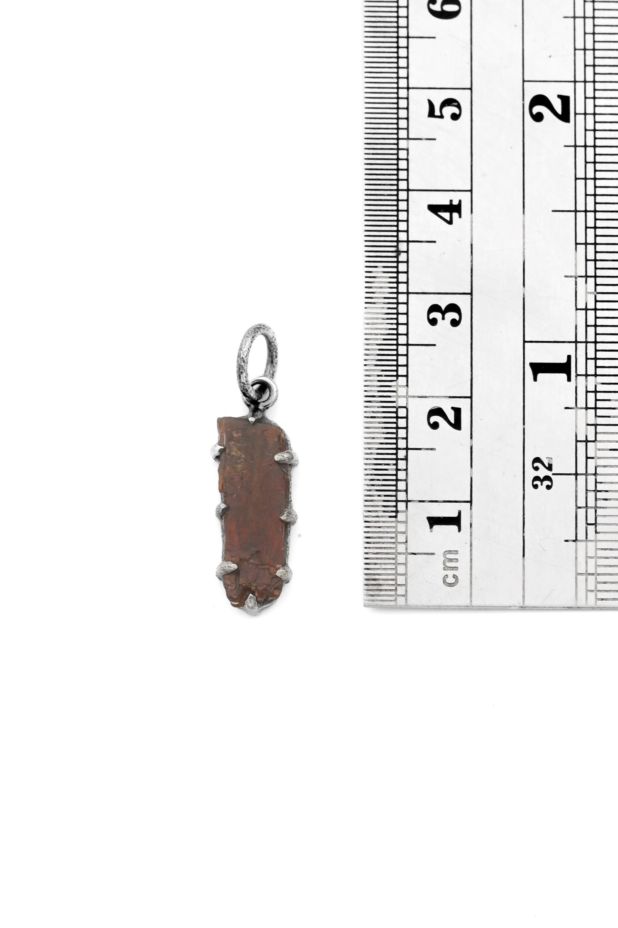 Tabular Orange Kyanite Pendant shown beside a ruler for scale, measuring approximately 2.8 cm including bail.