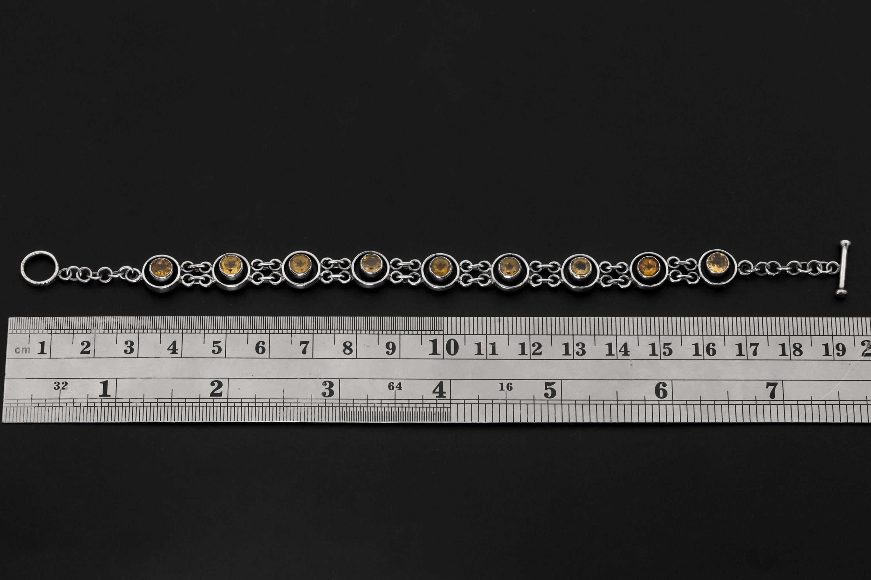 Citrine sterling silver bracelet shown beside a ruler for approximately 20 cm length reference.