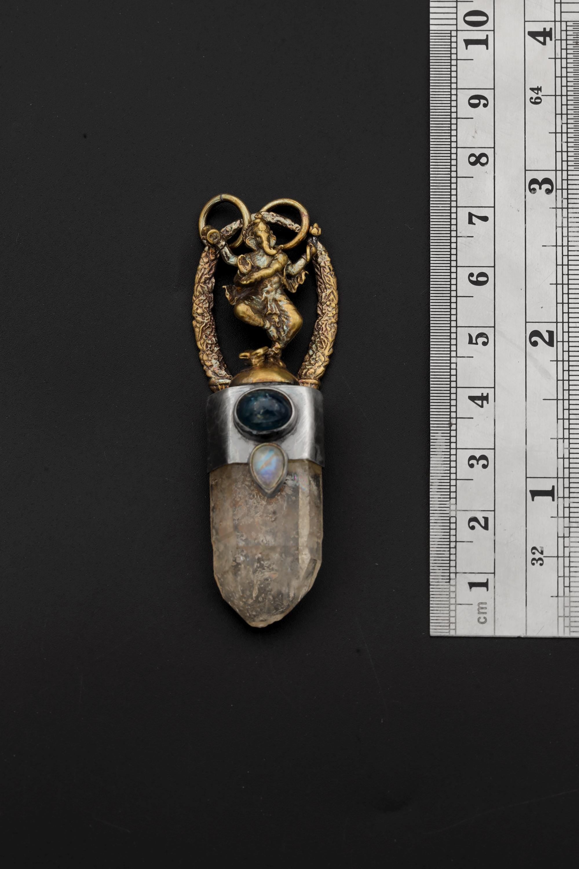 Ganesha Pyrite Quartz Kyanite Moonstone pendant shown beside a ruler for scale, measuring approximately 7 cm long.