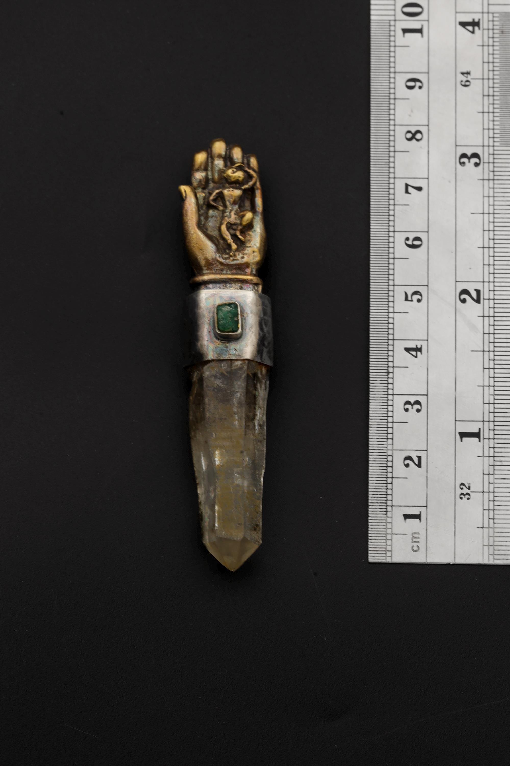 Measurement photo with ruler alongside pendant clearly showing total length and quartz point dimension.