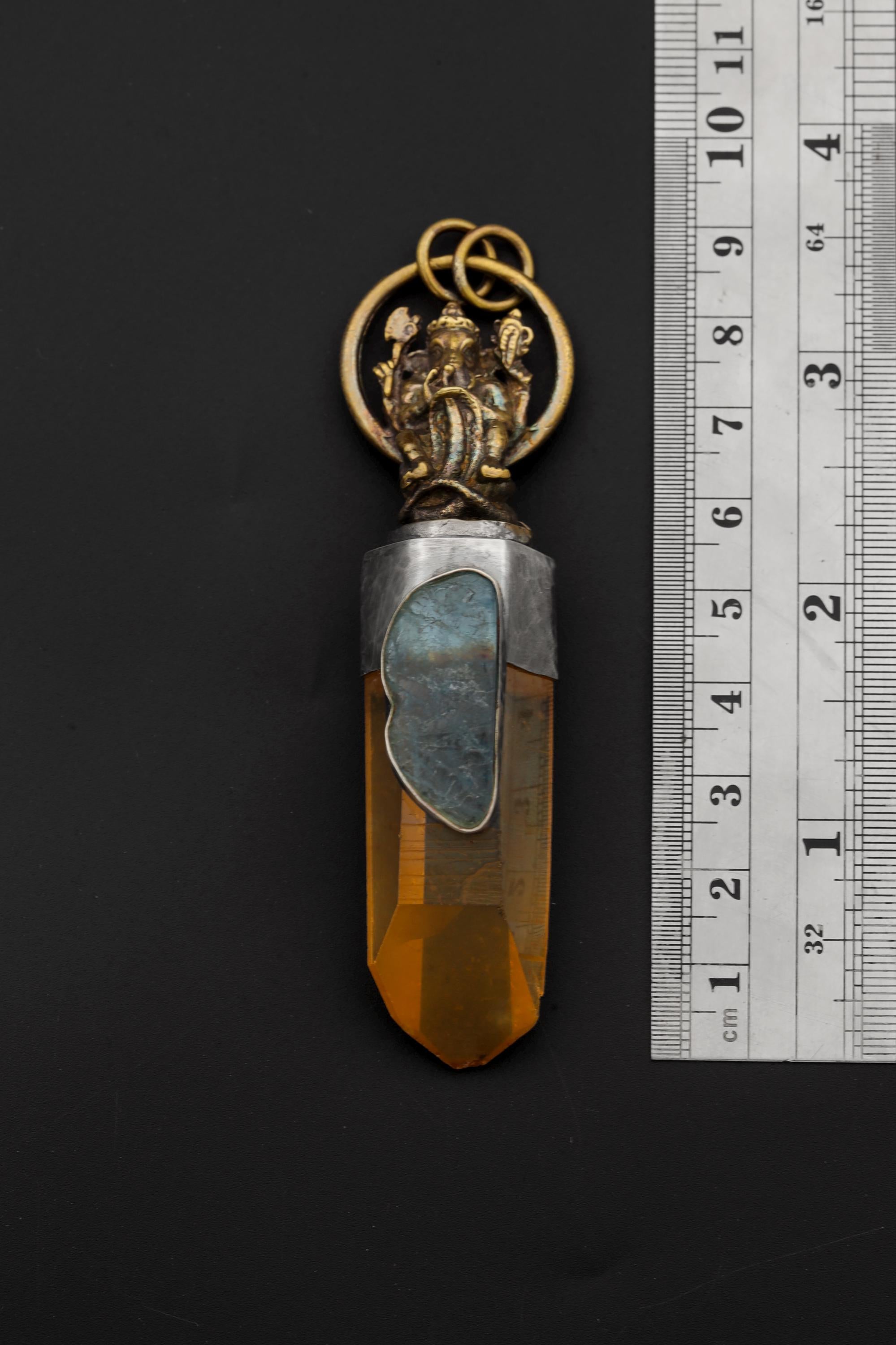 Ganesha Lemurian Quartz pendant shown beside a ruler for approximately 8.5 cm length reference.