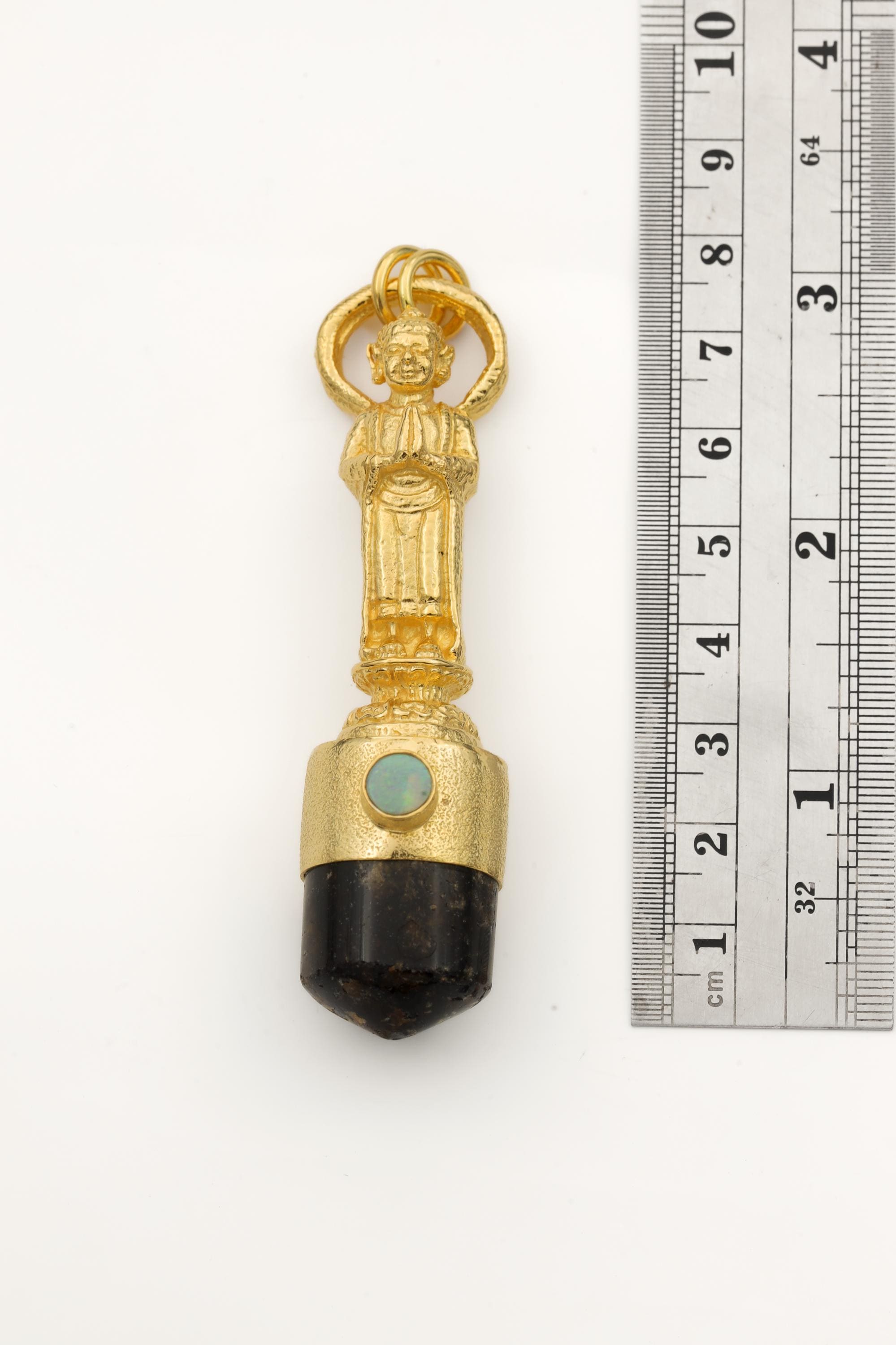 Measurement photo with ruler alongside pendant clearly showing total length and quartz point dimension.
