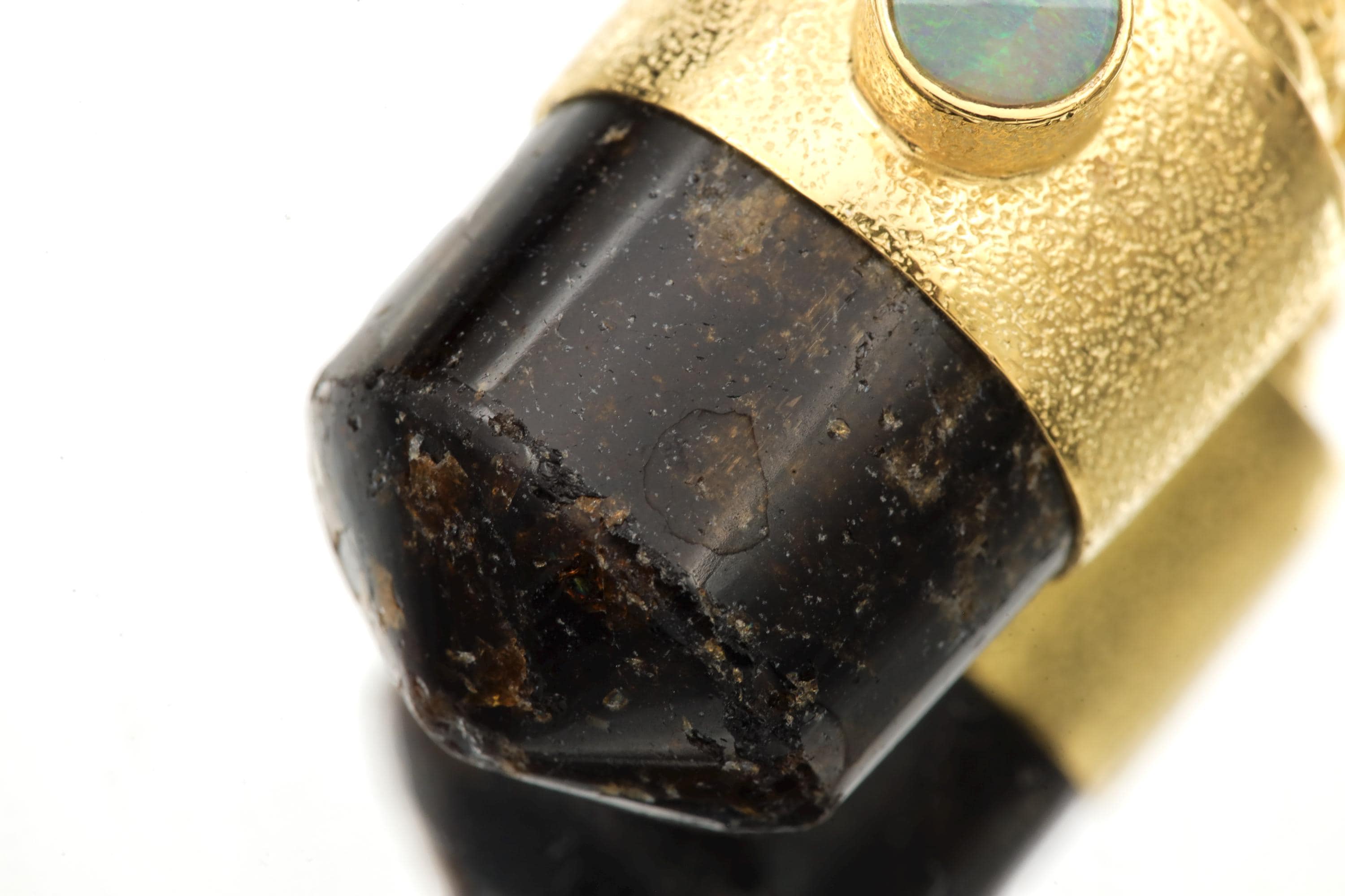 Macro photo of tourmaline termination showing clean polish, clarity, and fine surface texture.