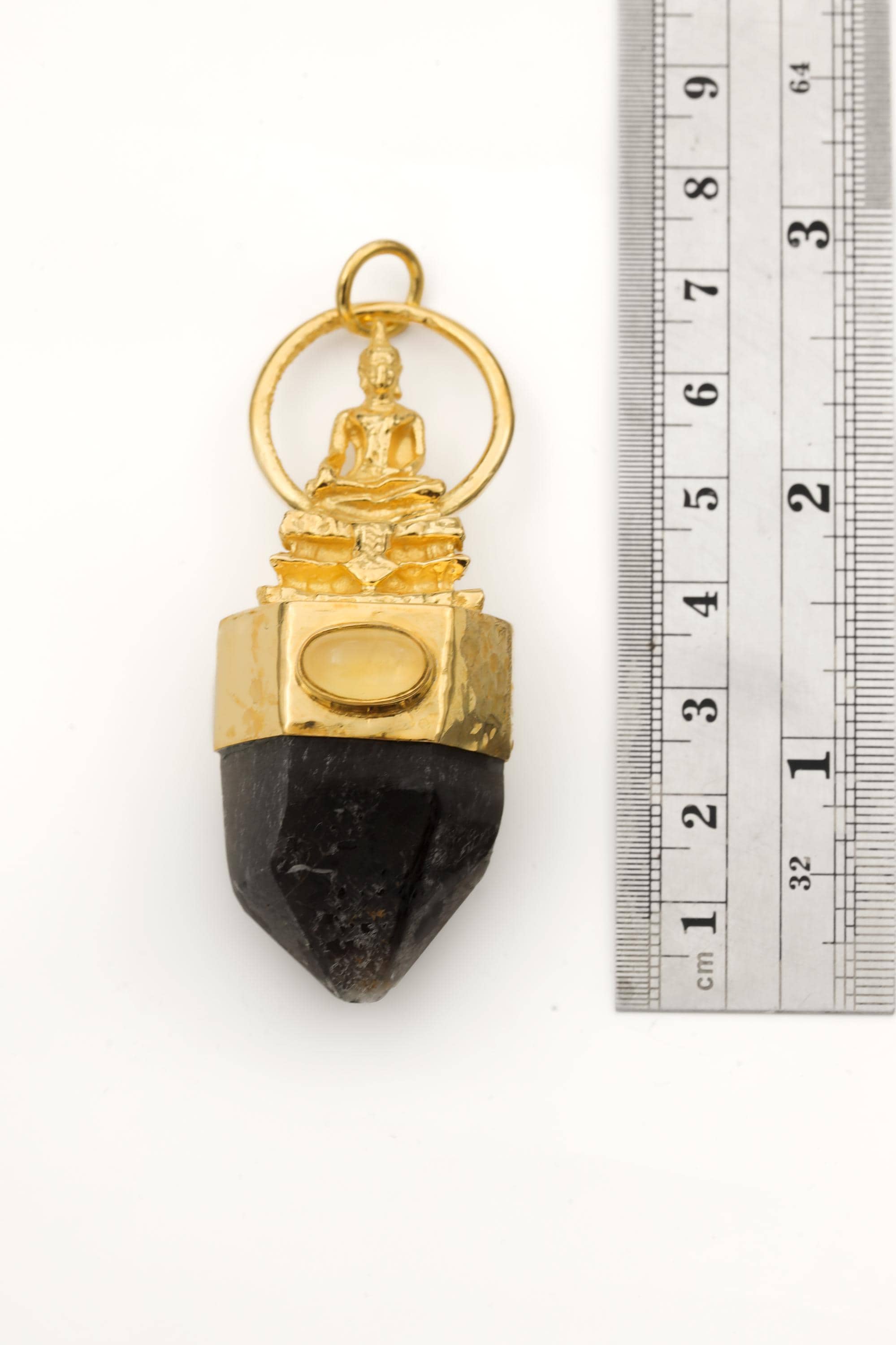 Measurement photo with ruler alongside pendant clearly showing total length and quartz point dimension.