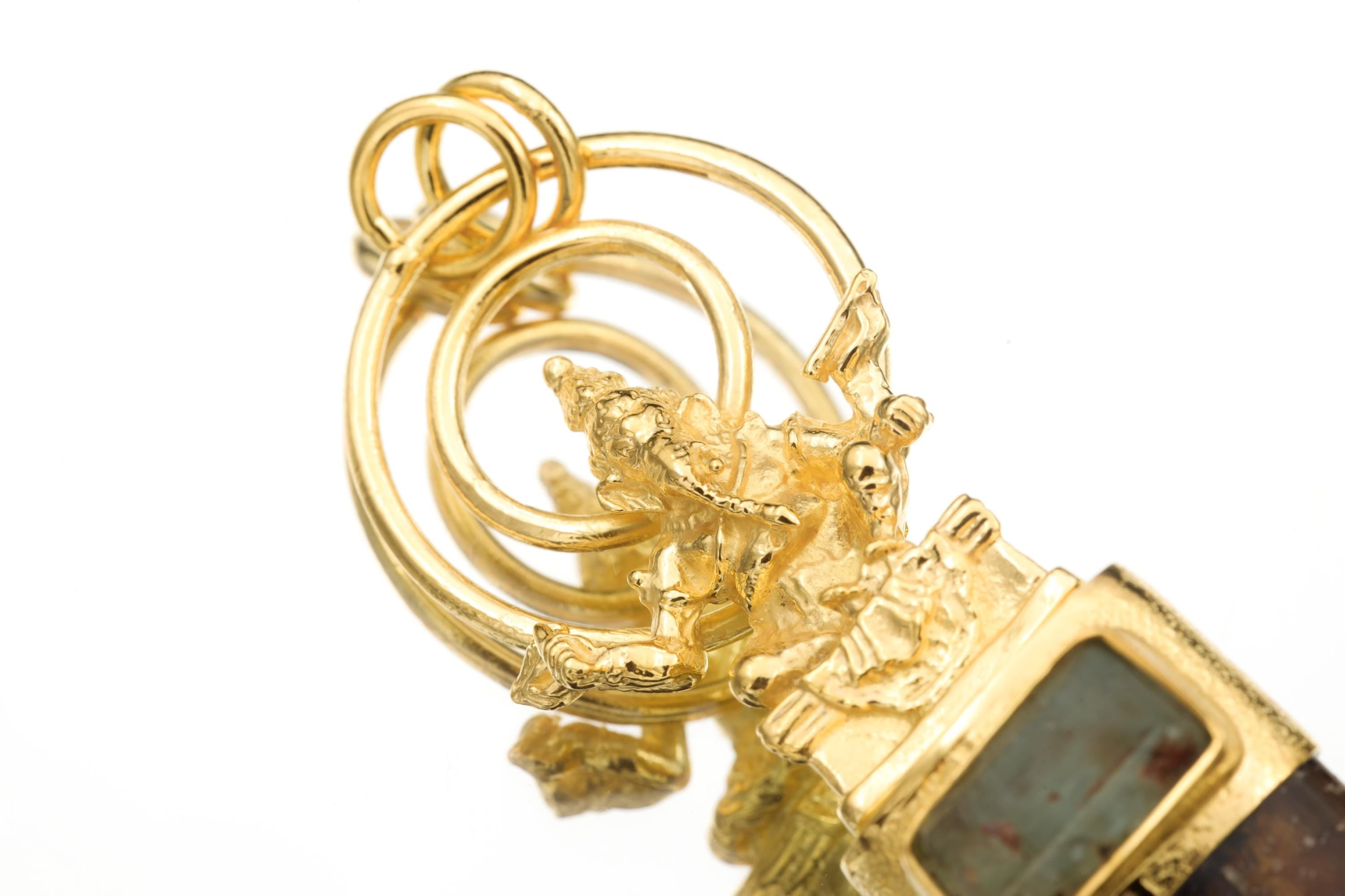 Overhead image displaying the alignment of Aquamarine and Tourmaline stones beneath the sculpted Ganesha form