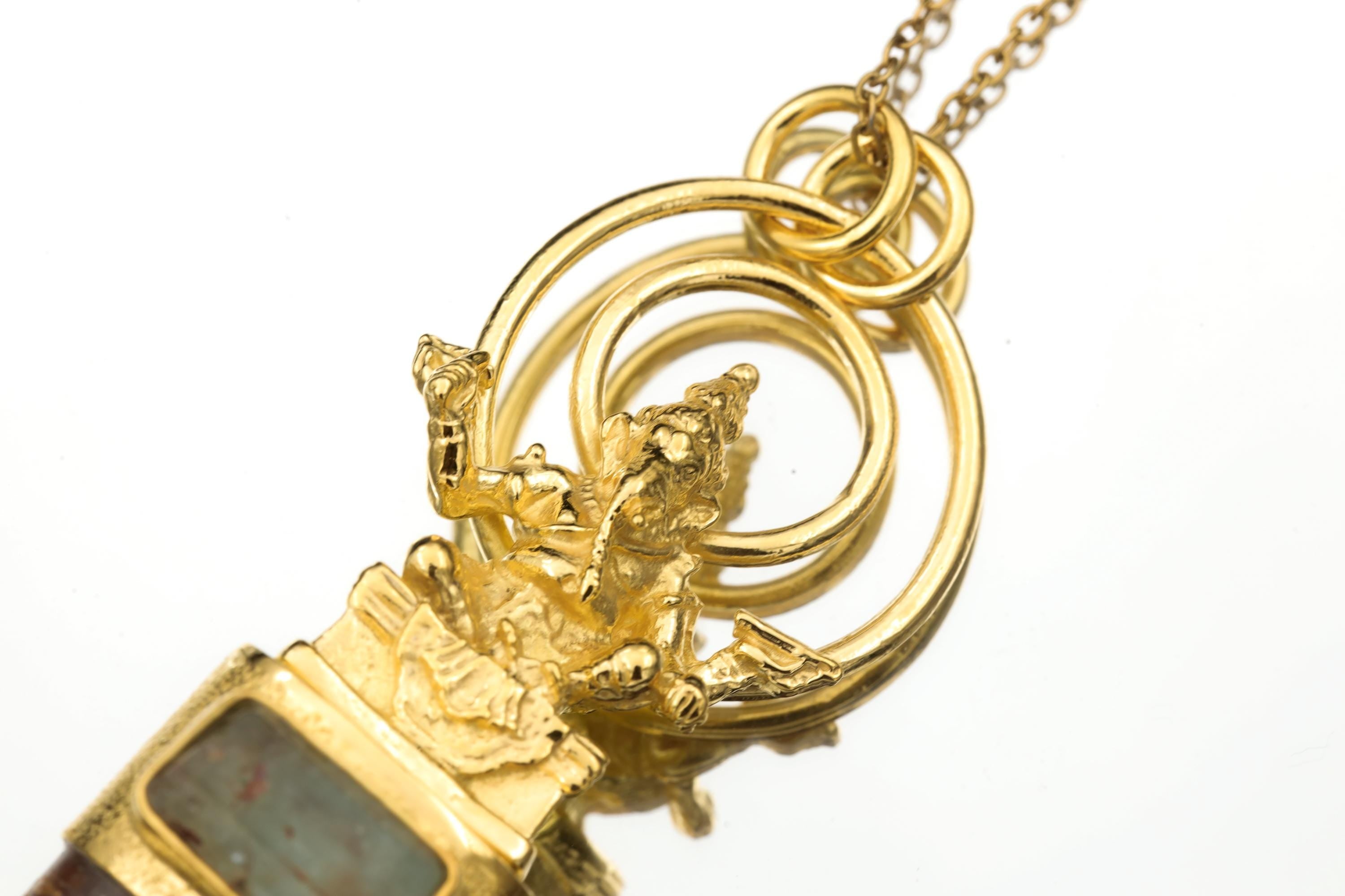Detail shot of Ganesha casting revealing sculptural precision, halo frame, and fine gold-plated surface.