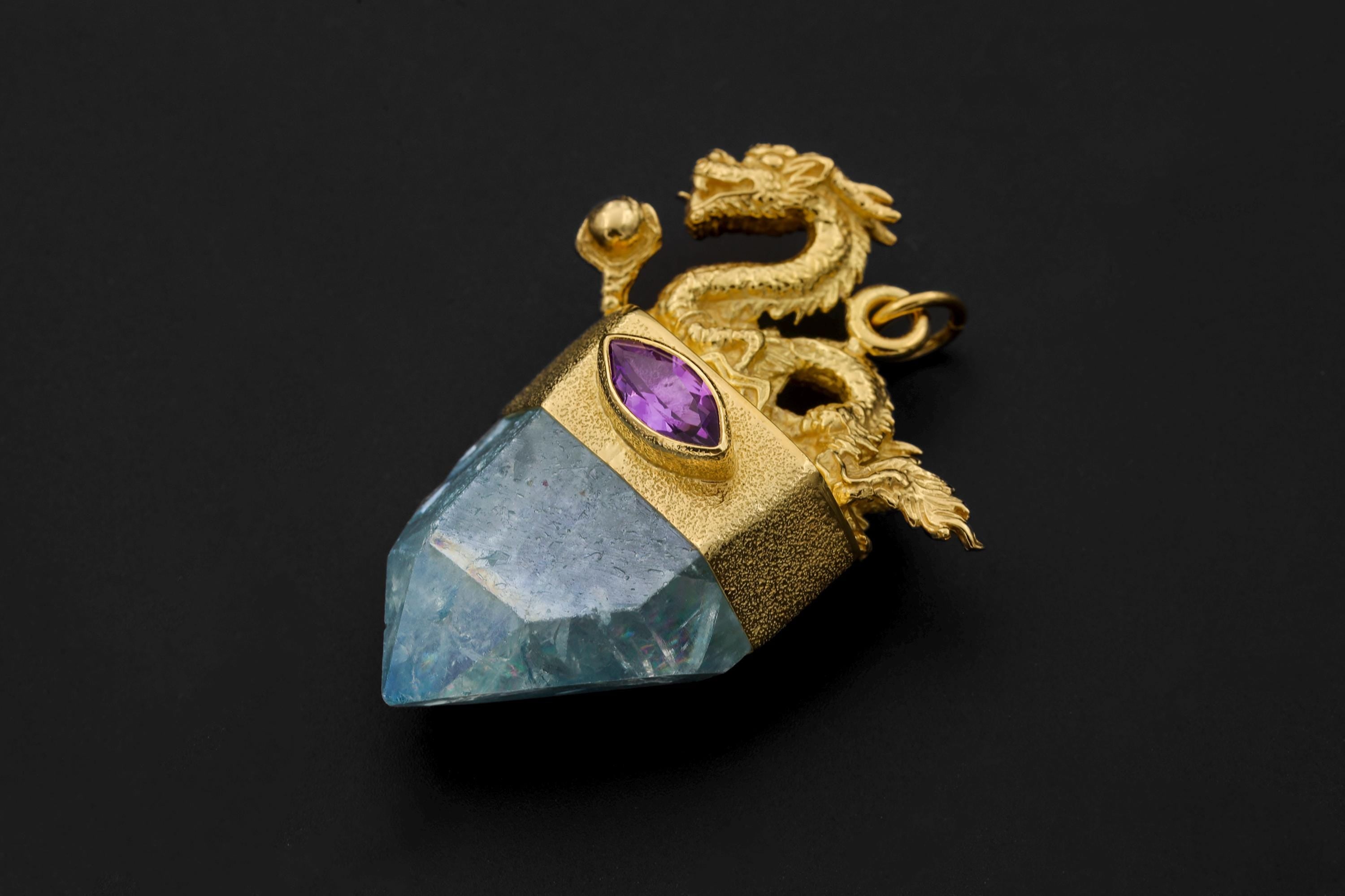 Artistic photo showing pendant suspended against dark gradient background accentuating brilliance and dimension.