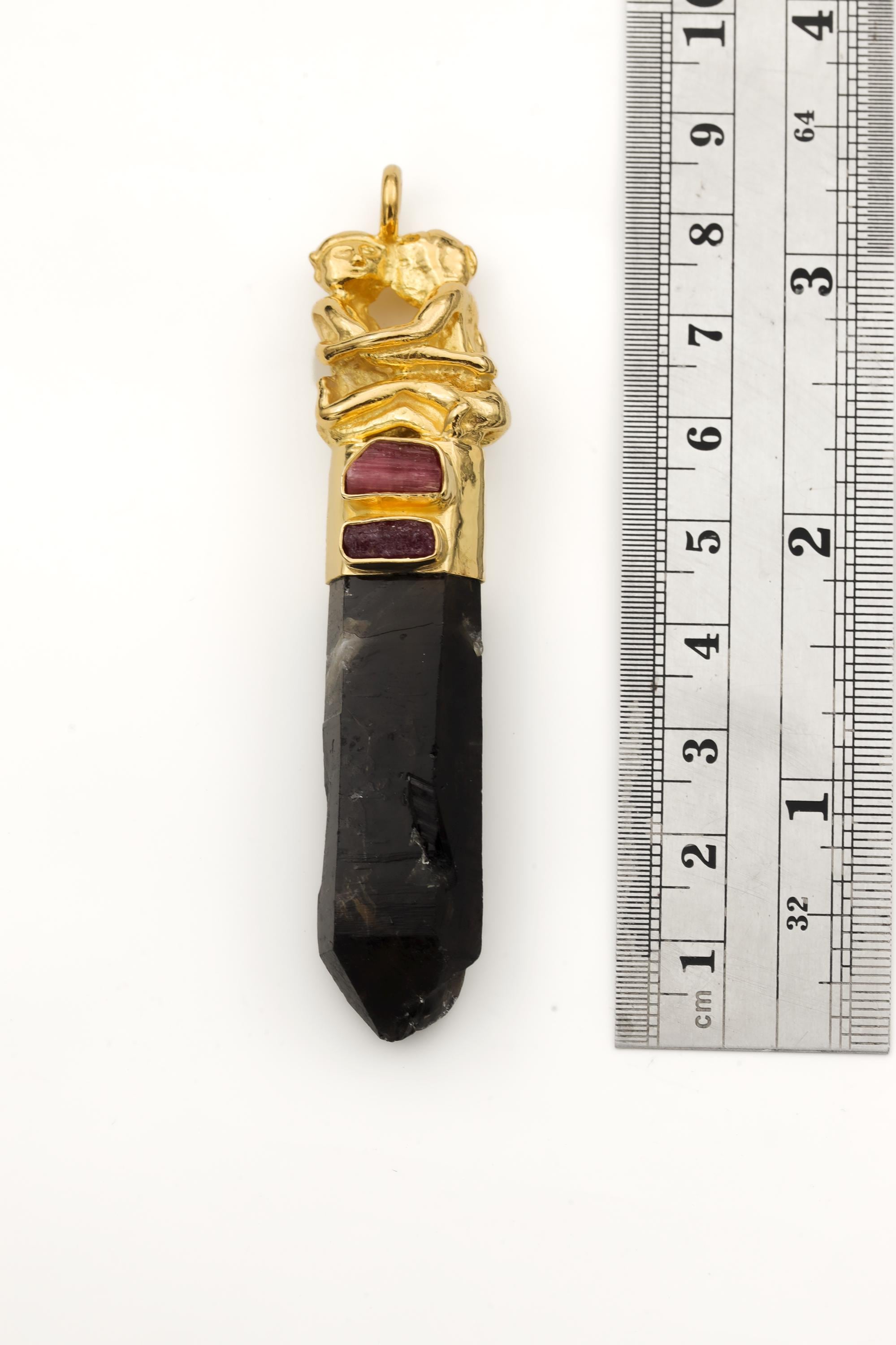 Measurement photo with ruler alongside pendant clearly showing total length and quartz point dimension.