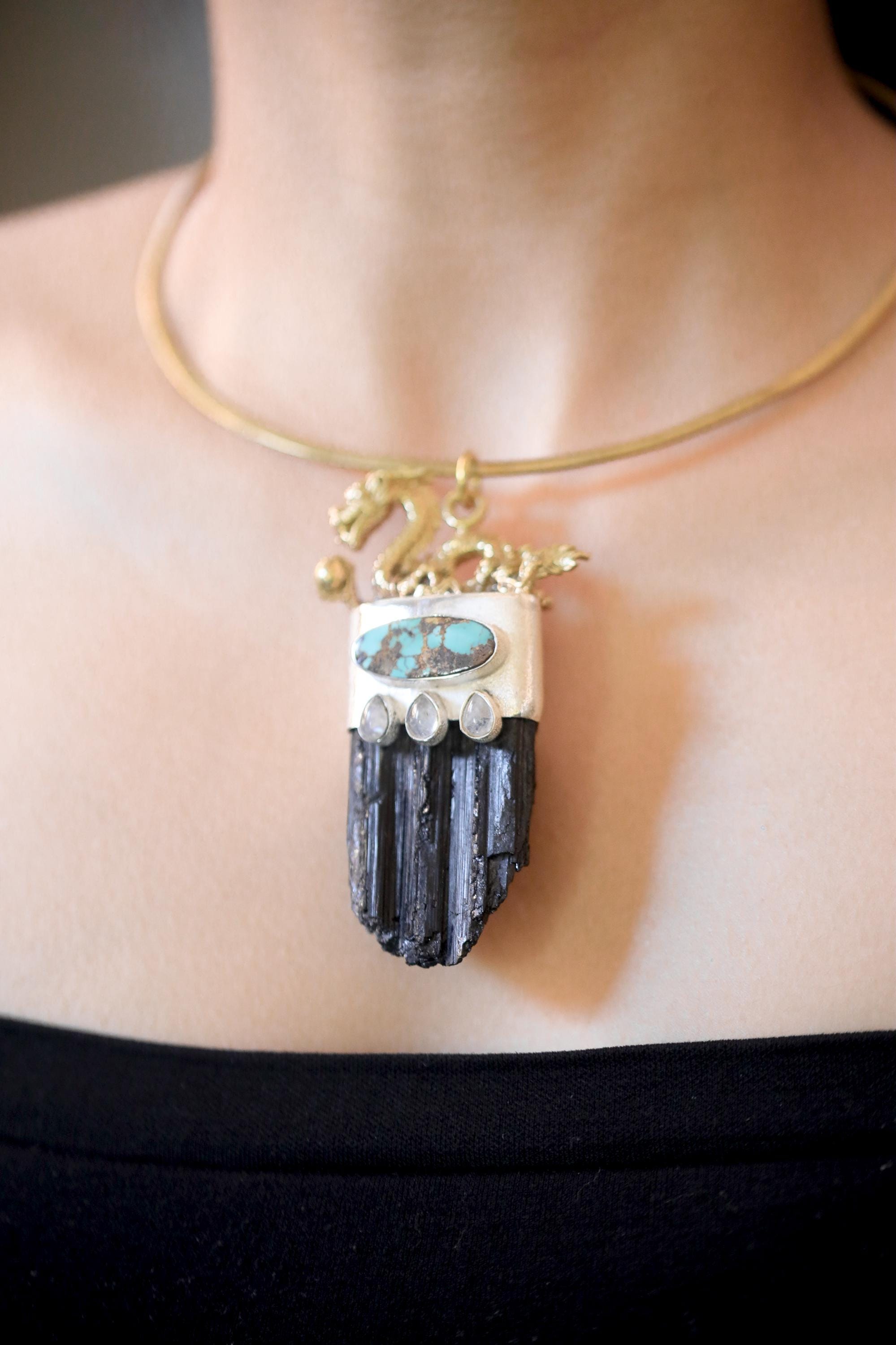 Model shot emphasizing how pendant sits elegantly at collarbone with balanced stone alignment.