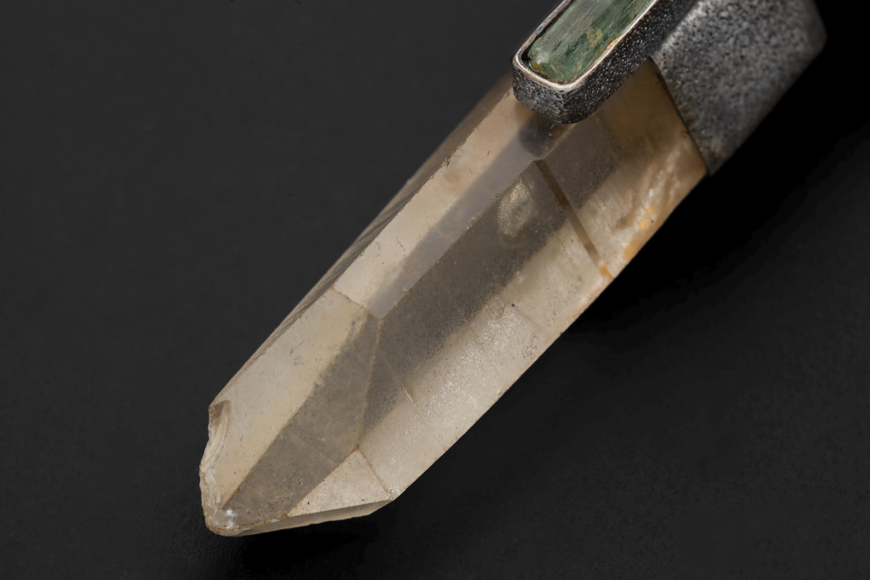 Close-up of Lemurian Window Quartz in a sand-textured oxidized silver pendant setting.