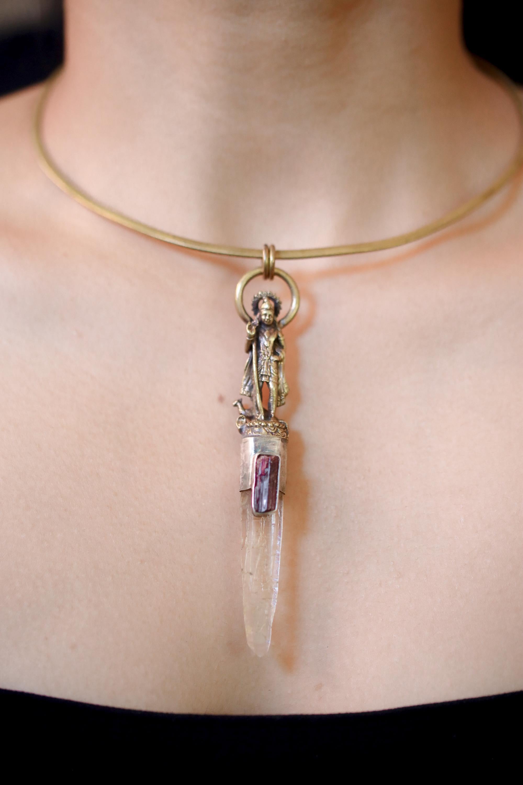 Model wearing pendant under natural light, showing proportional size and color balance of stones.