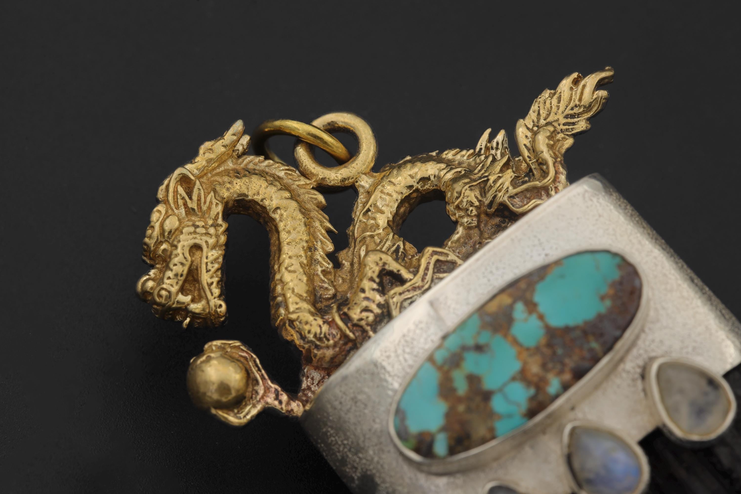 Overhead view showing sculpted dragon wings and polished stone surfaces in natural lighting.