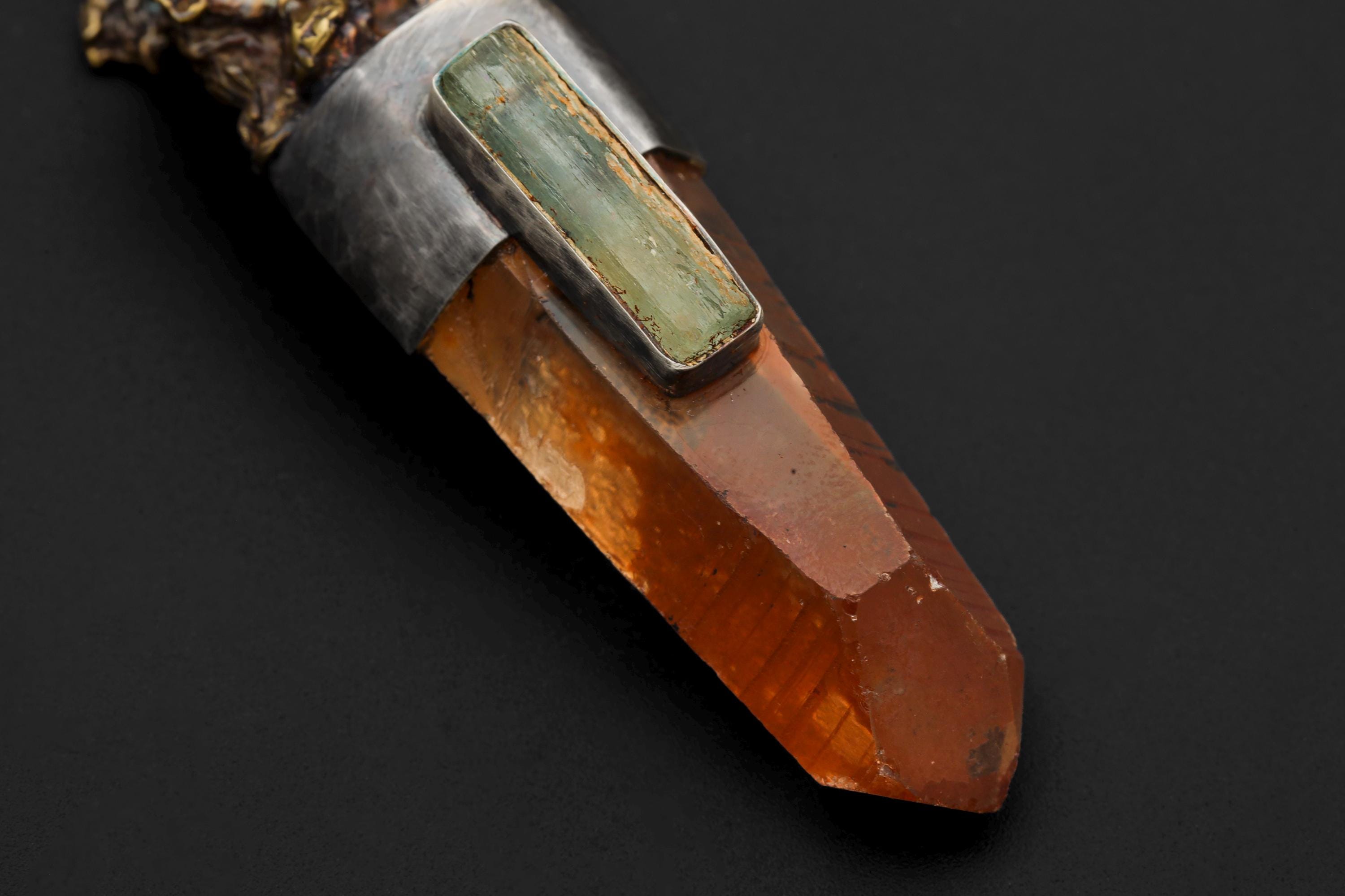 Overhead image capturing the structure of the Lemurian Laser Quartz and subtle aquamarine glow.