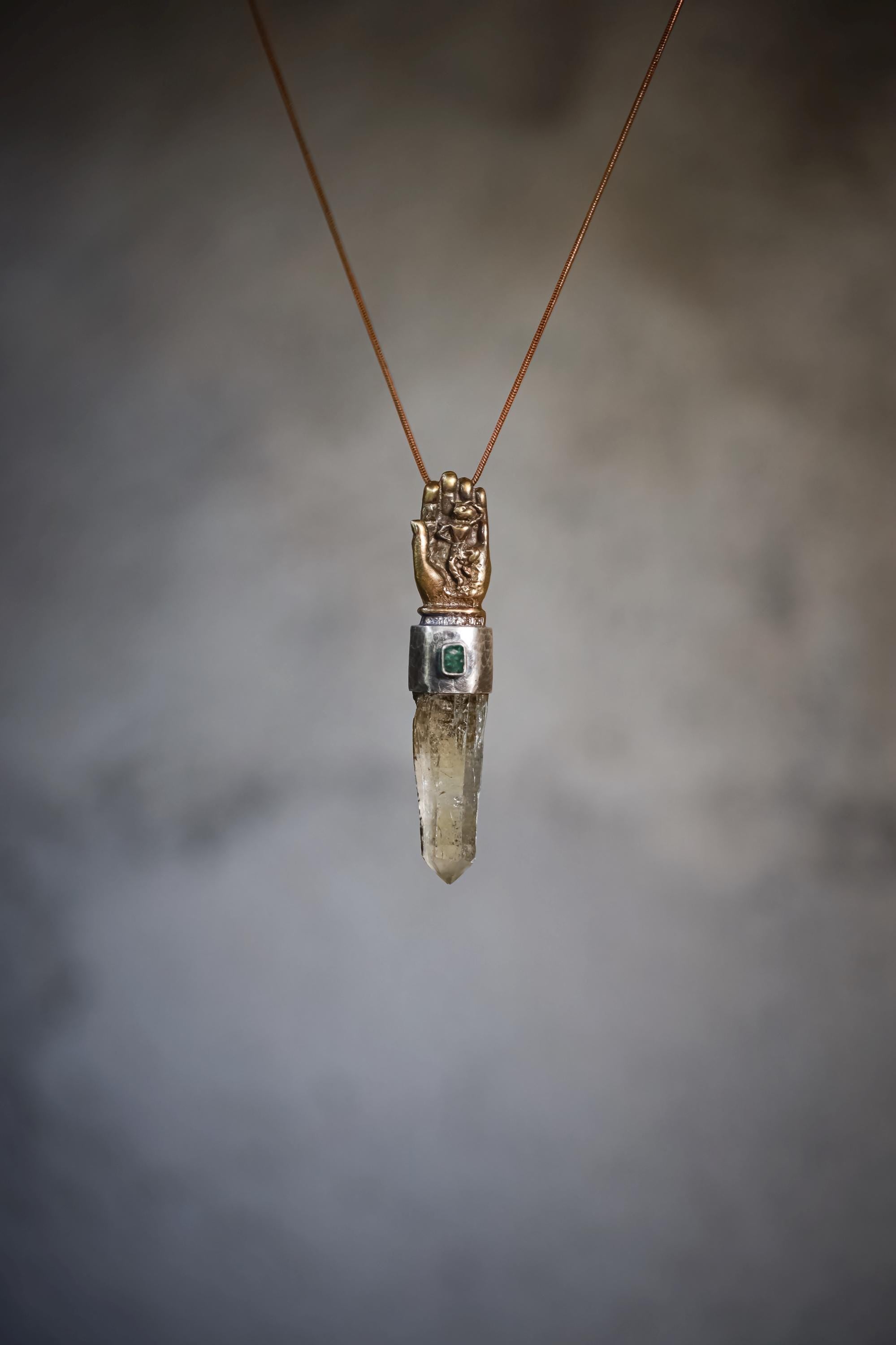 Necklace worn on model with clear frontal view showing pendant centered and natural posture reference.