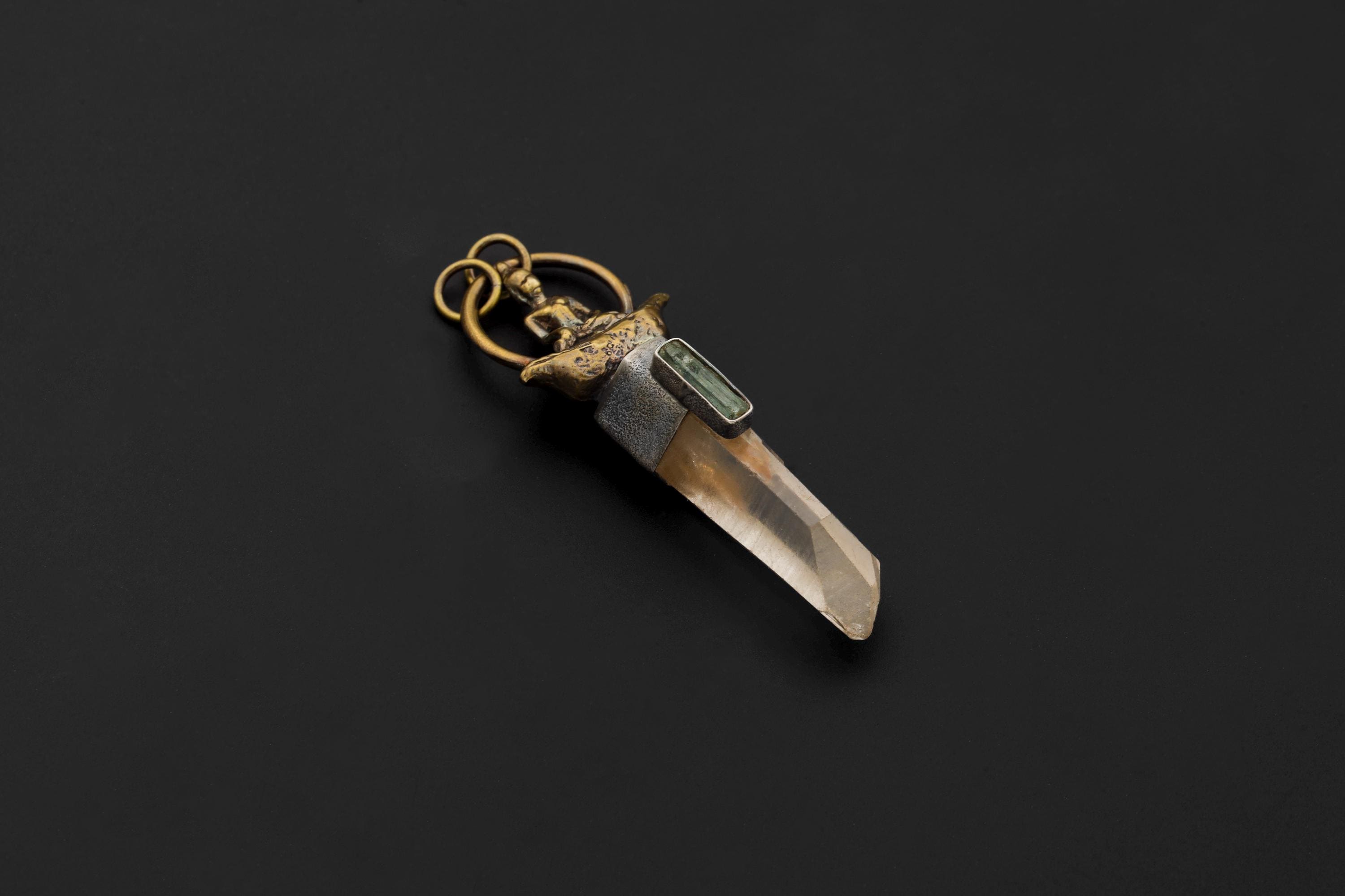 Overhead view capturing the geometric clarity of Lemurian Window Quartz and textural quality of sand-finished bezel.