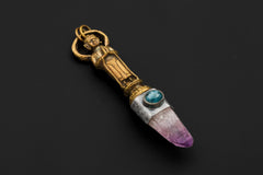 Buddha Talisman pendant on black background featuring brass-cast Buddha figure, Vera Cruz Amethyst laser point, and High-Grade Australian Ocean Kyanite set in oxidized textured 925 silver bezel.