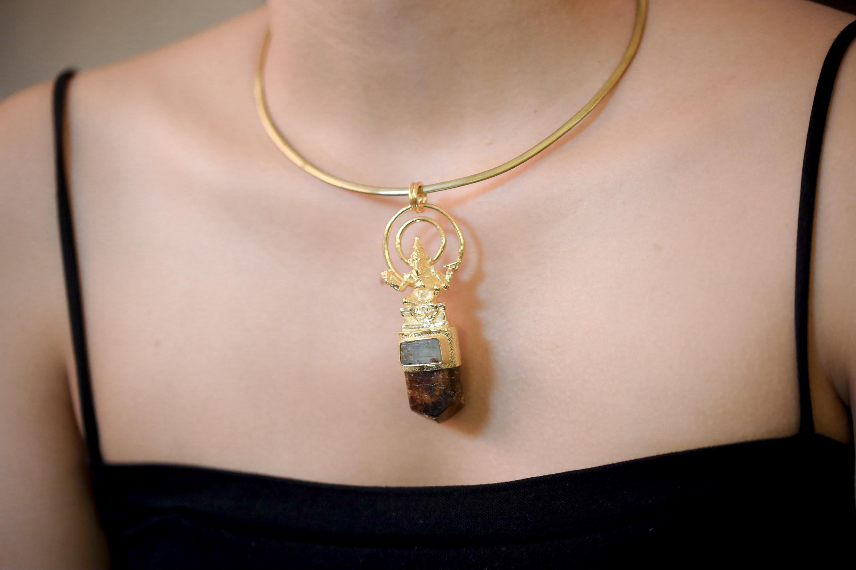 Model wearing pendant under natural light illustrating proportional size, pendant drop, and spiritual aesthetic.