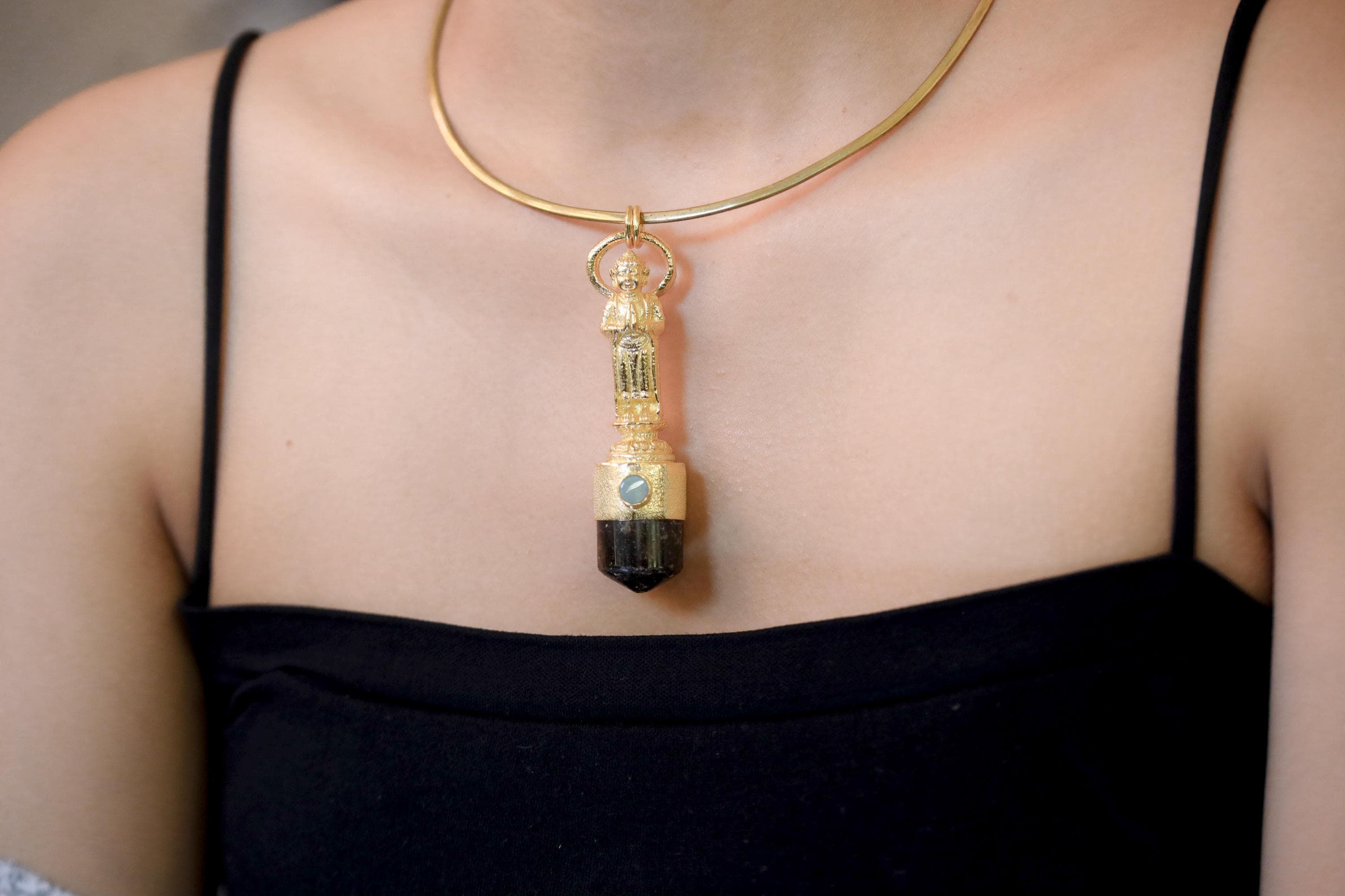 Pendant worn at mid-chest height showing elegant drop and centered positioning.