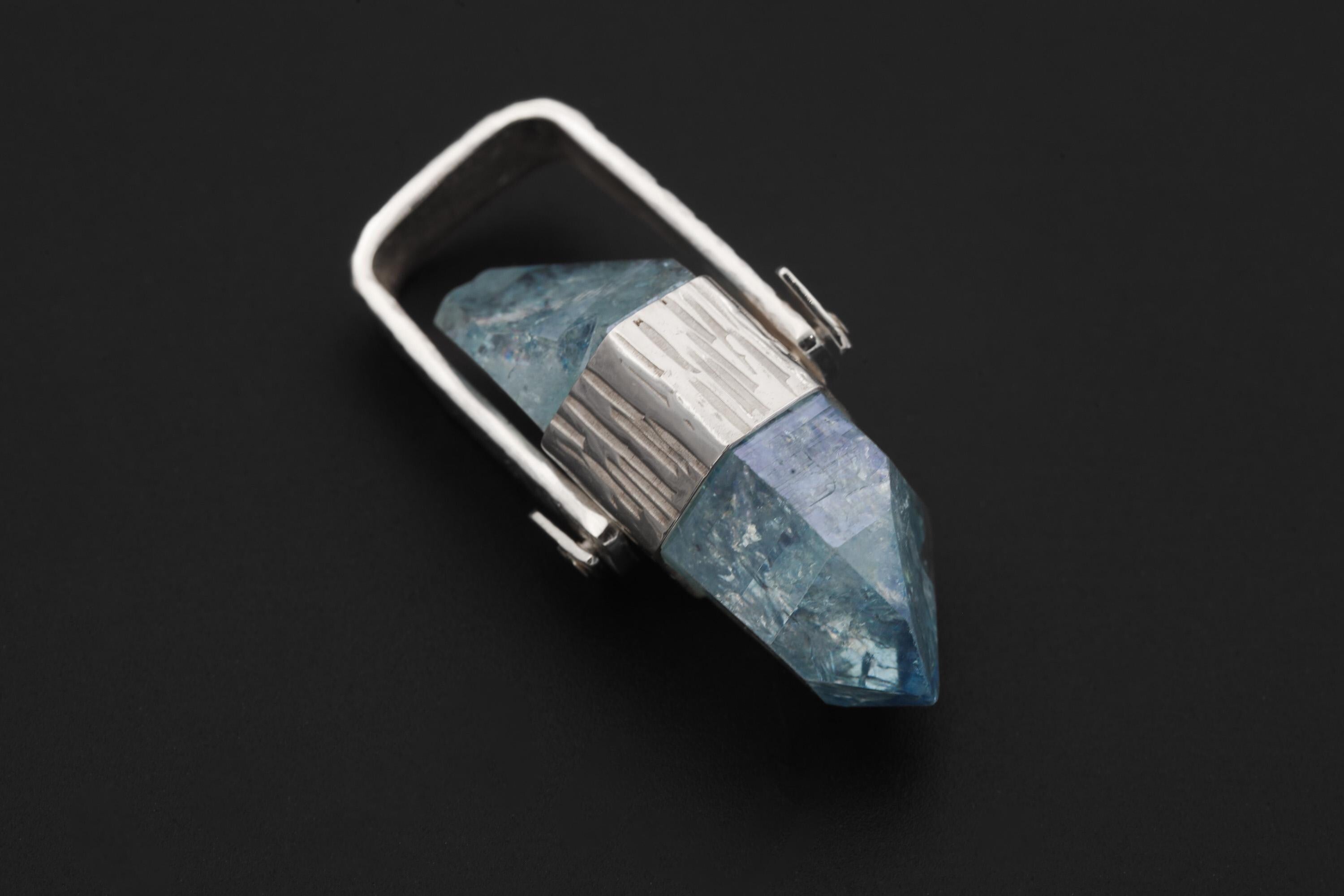 Double Terminated Aqua Aura Quartz pendant on black background with line-hammered sterling silver and wide hinged bail.