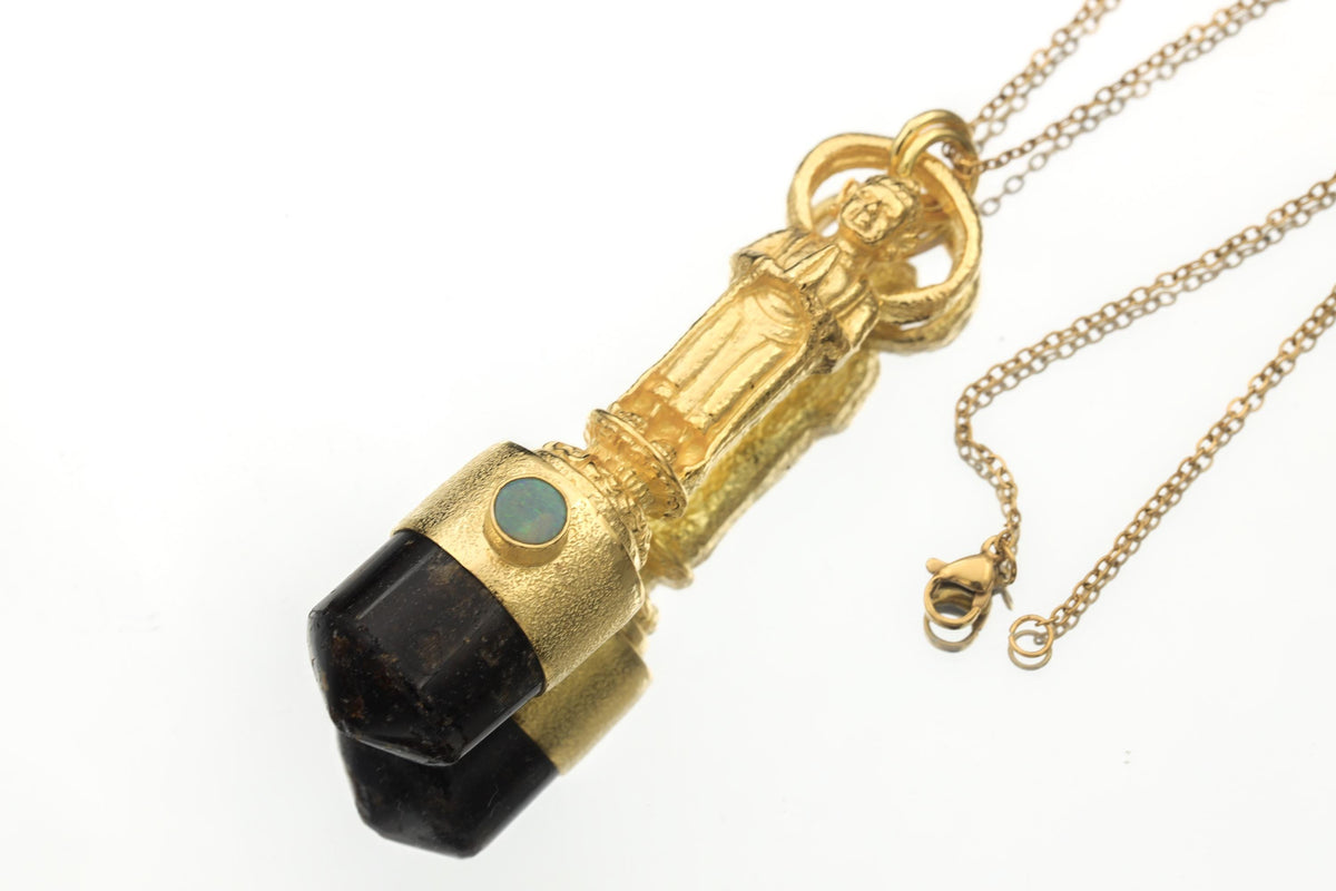 Buddha Light Talisman pendant shown on a white background with gold-plated brass Buddha, Lightning Ridge Opal, and Dravite Tourmaline.