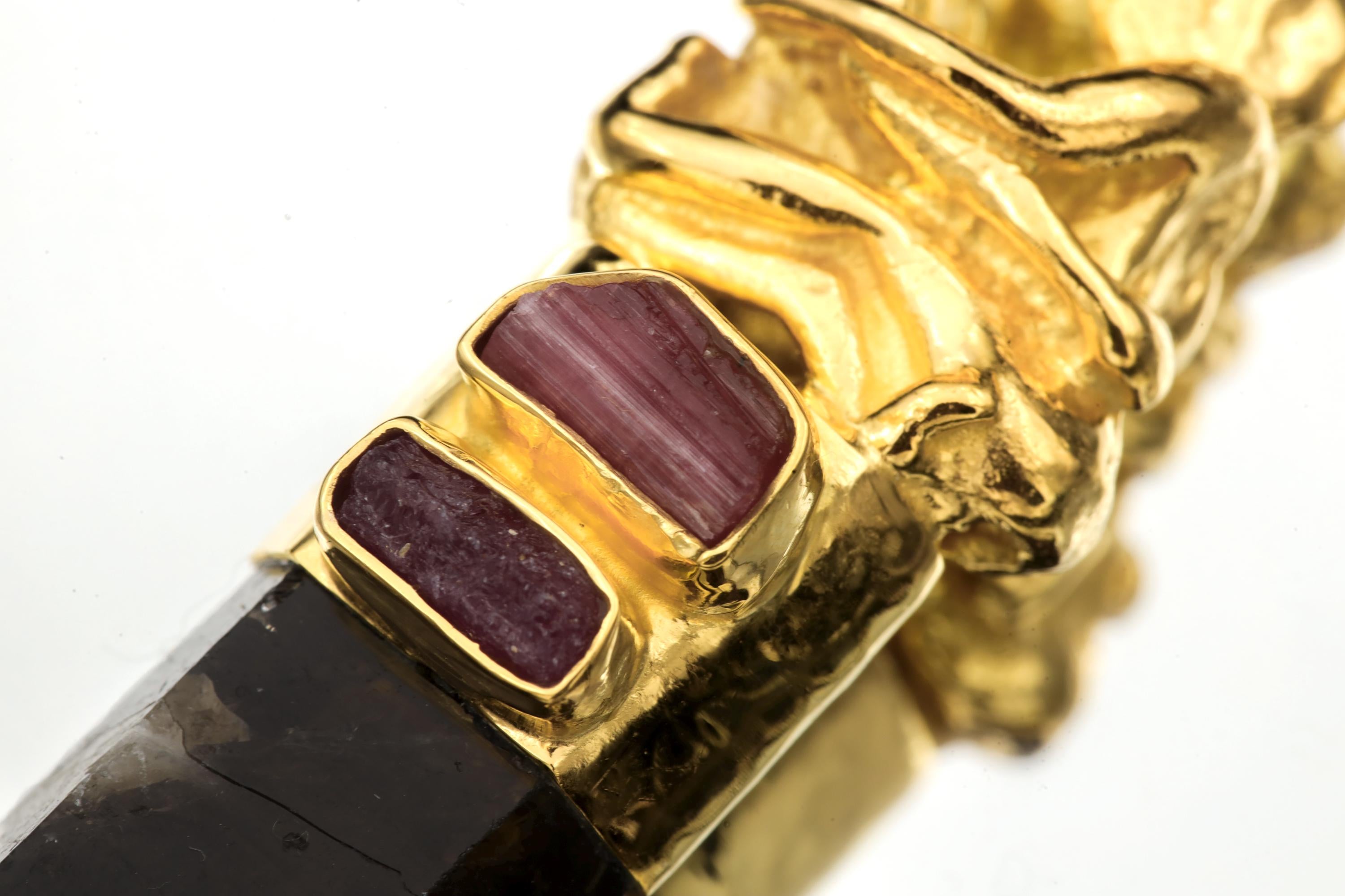 Side macro image of quartz termination revealing natural inclusions and smoky gradient shading.