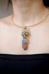 Pendant worn on model chest showing full length and warm earthy tones of quartz combined with cool Aquamarine hue.