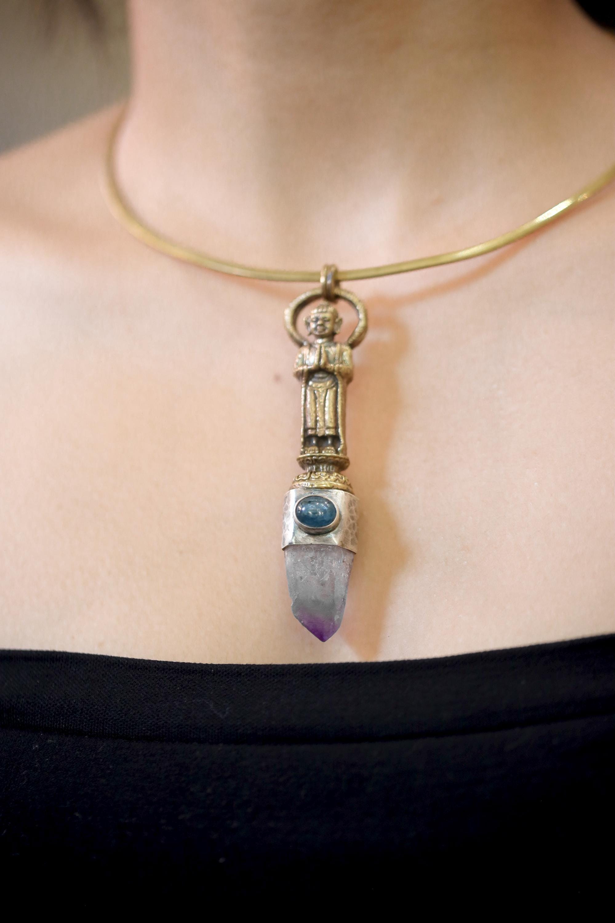 Pendant worn on model displaying proportion, vertical alignment, and light interplay between amethyst and kyanite.