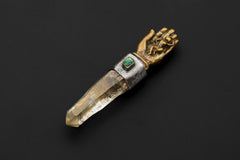 Monkey King Buddha Hand Brass Cast Pendant on black background featuring sculpted brass Buddha hand holding a Himalayan Optical Lemurian Chlorite Laser Quartz point with raw emerald bezel set in oxidized and textured silver.