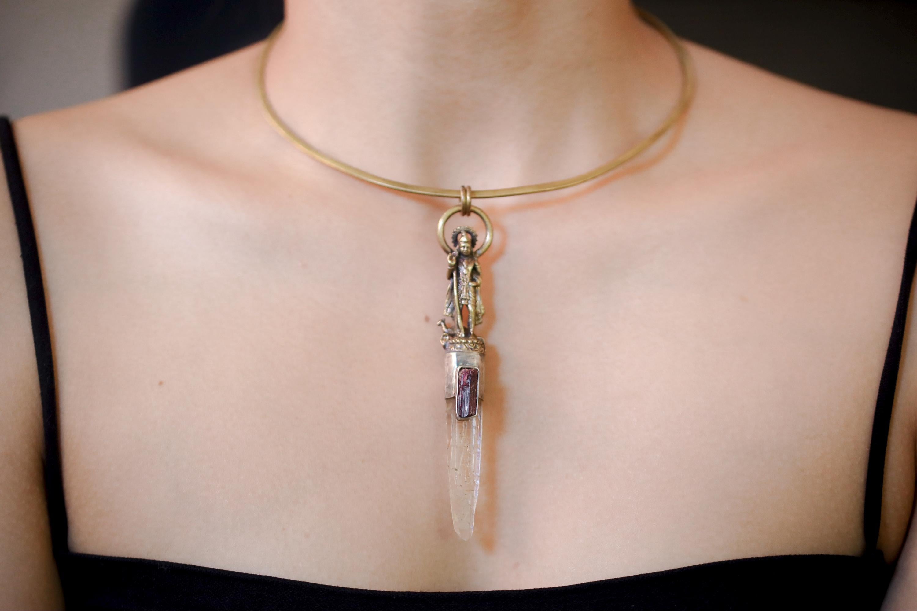 Overhead image displaying vertical orientation of pendant and luminous facets of the Lemurian Laser Quartz.