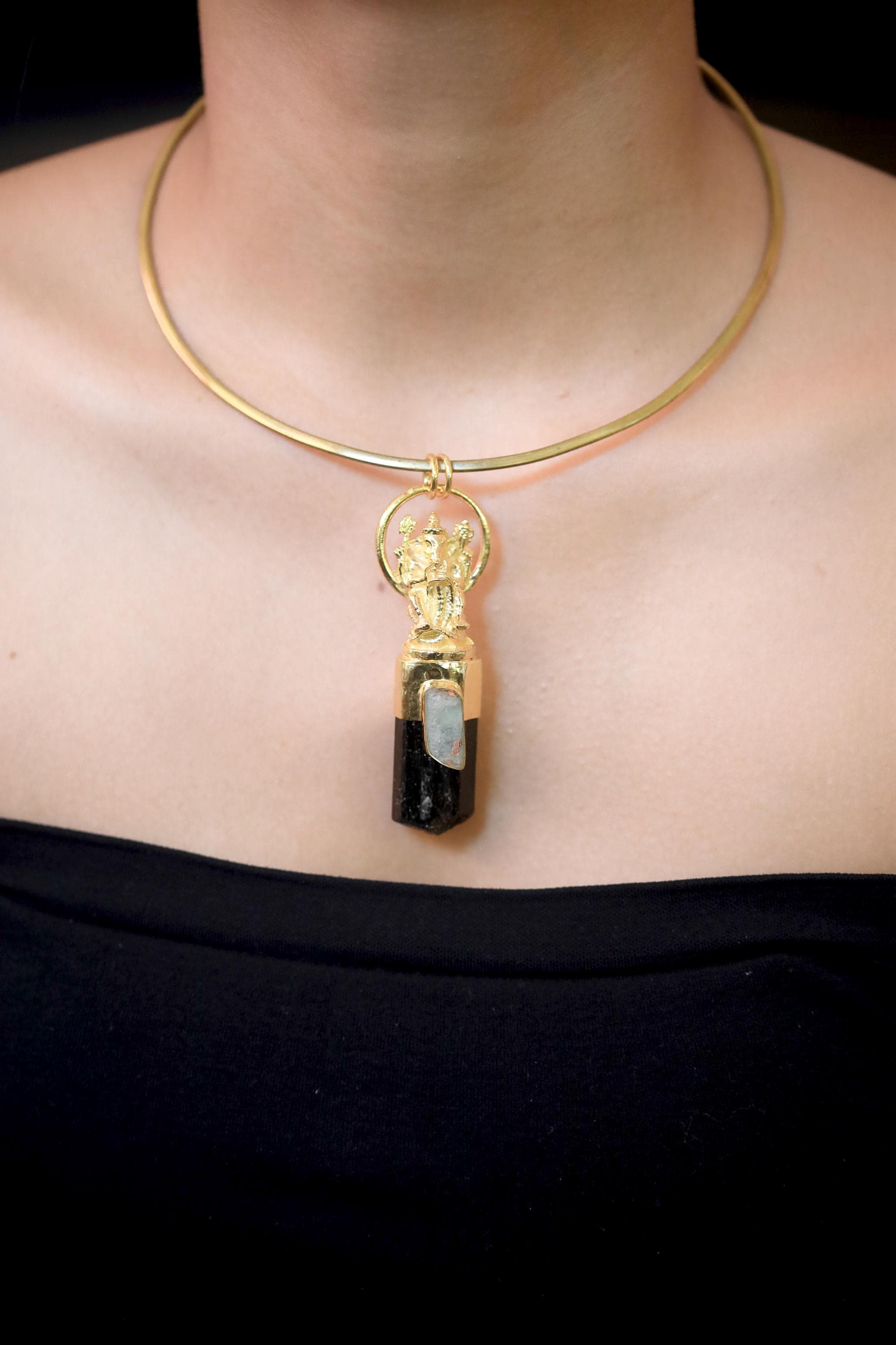 Overhead view highlighting proportion between aquamarine inset and raw tourmaline crystal termination.