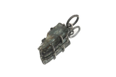 High Grade Blue Tourmaline pendant on white background showing raw Indicolite crystal and oxidized silver claw frame.