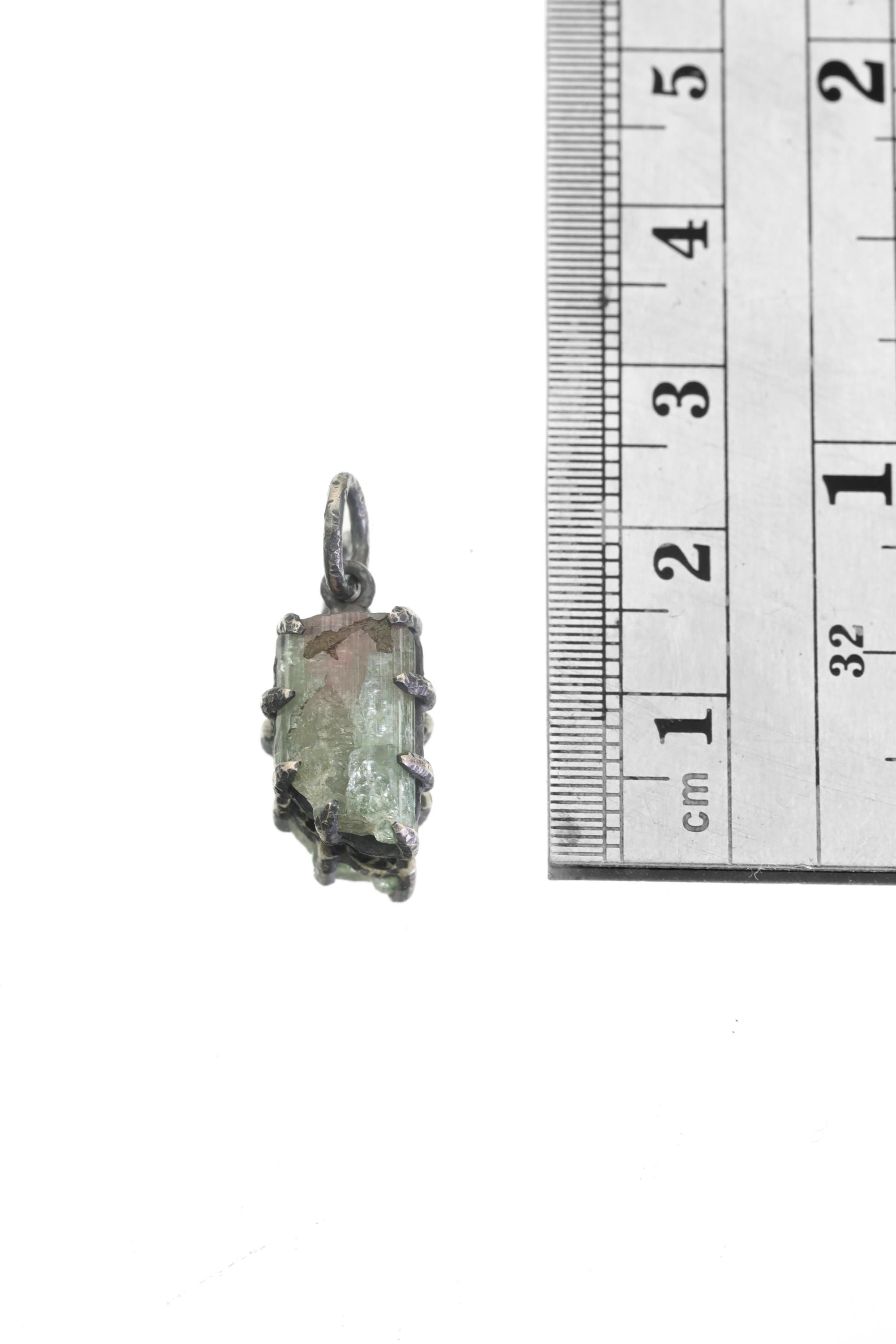 Measurement photo showing total pendant length beside ruler for scale reference.