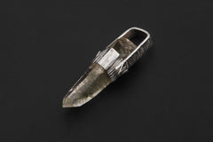 Himalayan Lemurian Chlorite Rutile Quartz pendant on black background with bark-textured sterling silver cap and natural crystal point.
