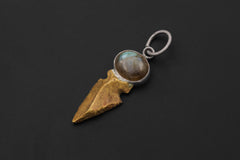 Labradorite and Obsidian spearhead talisman displayed on black background with brass point.