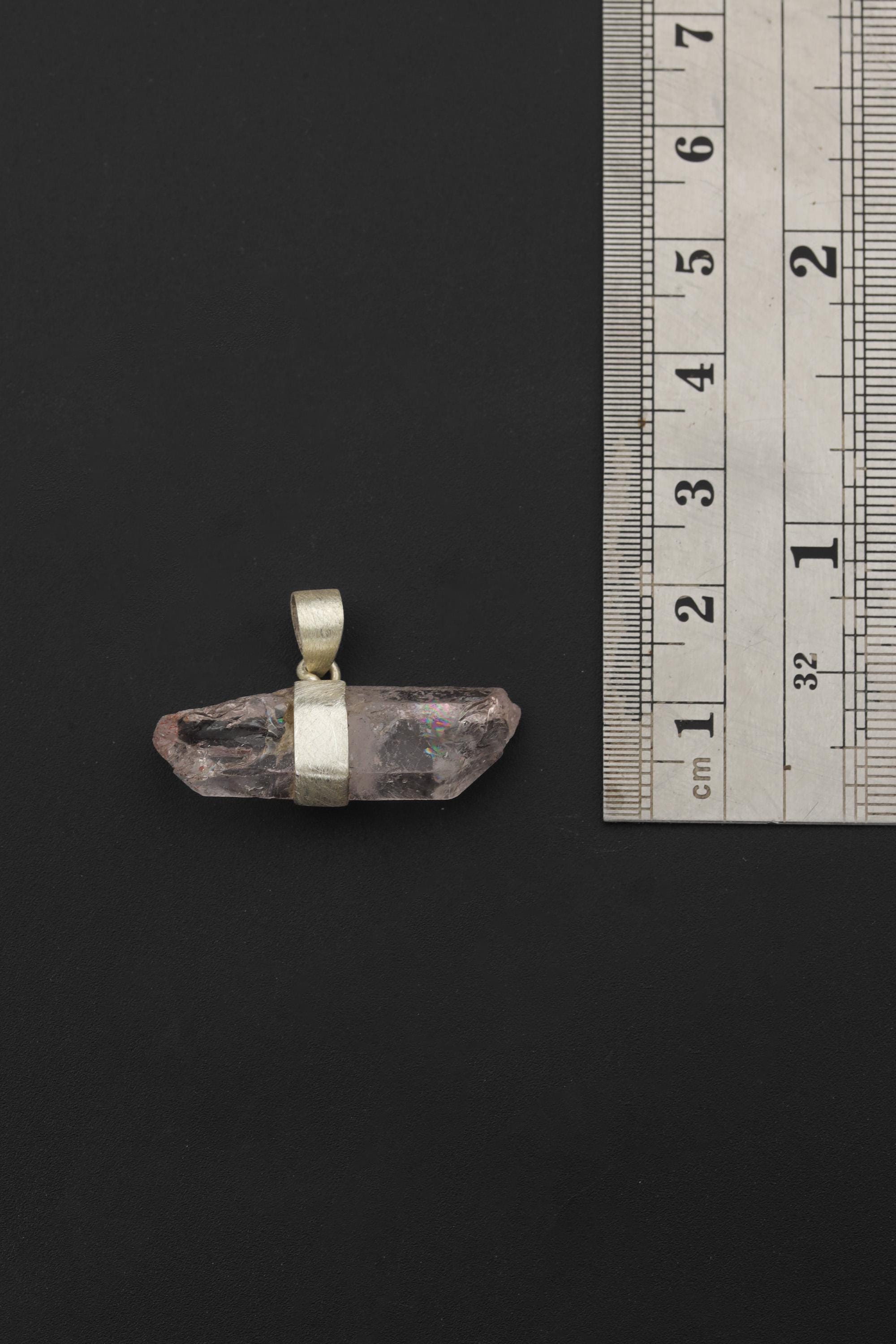 Anhydro Vera Cruz Amethyst pendant shown beside ruler for approximate 4 to 5 cm size reference.