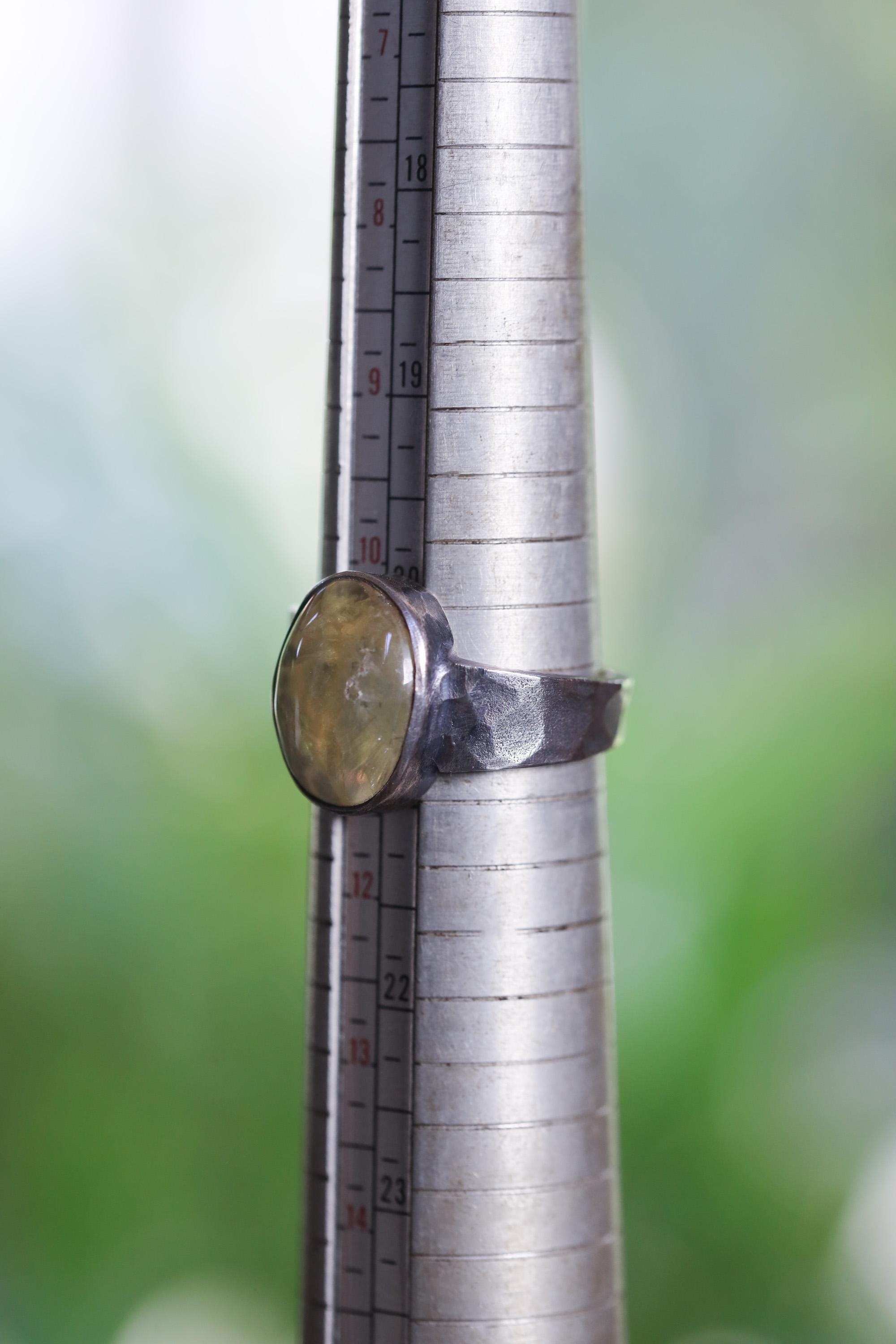 Australian Prehnite men’s ring shown beside a ruler for scale, with fixed US size 11 band and oxidized silver setting.