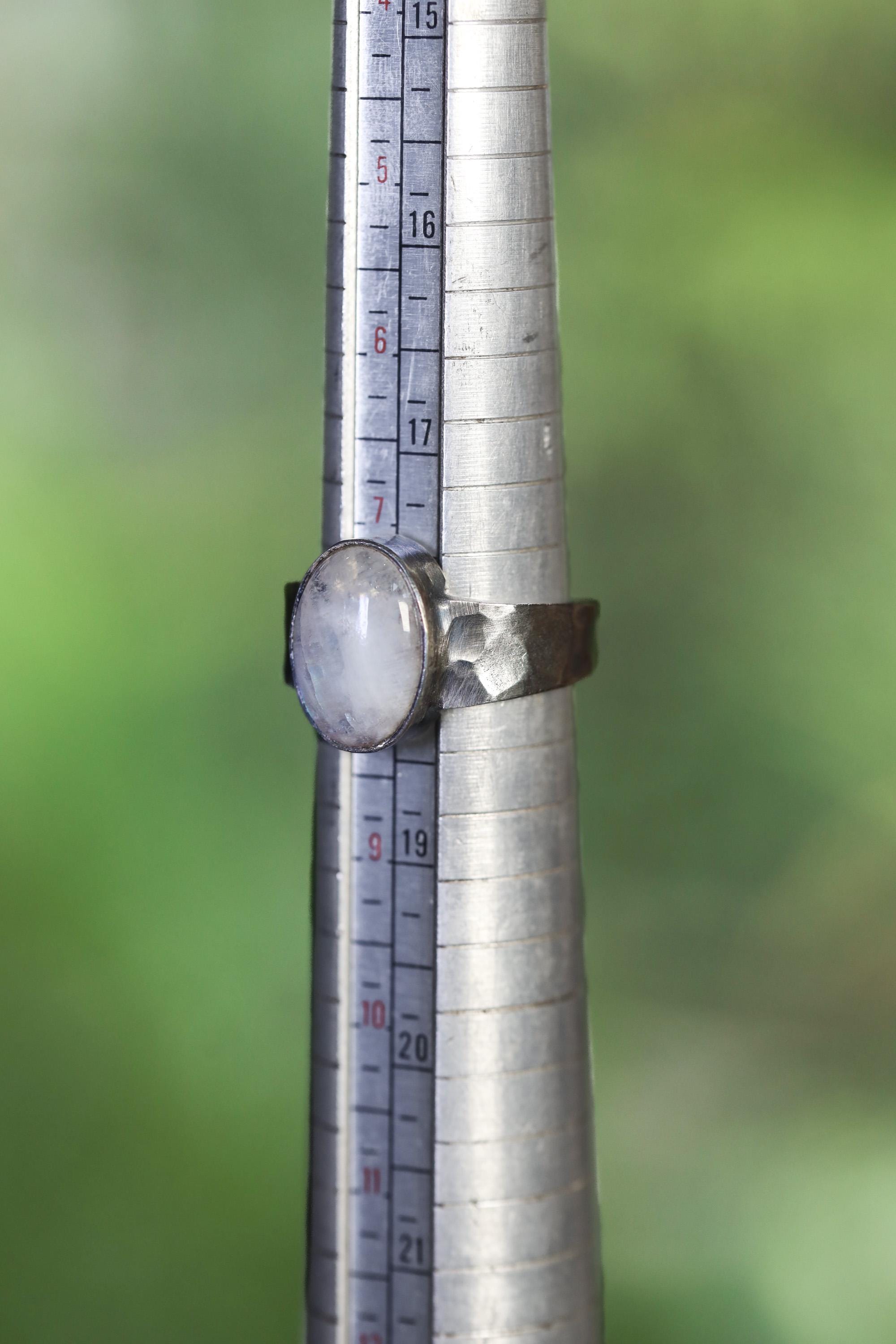 AAA Blue Moonstone men’s ring shown beside a ruler for scale, with oxidized 925 sterling silver and fixed US size 8 band.