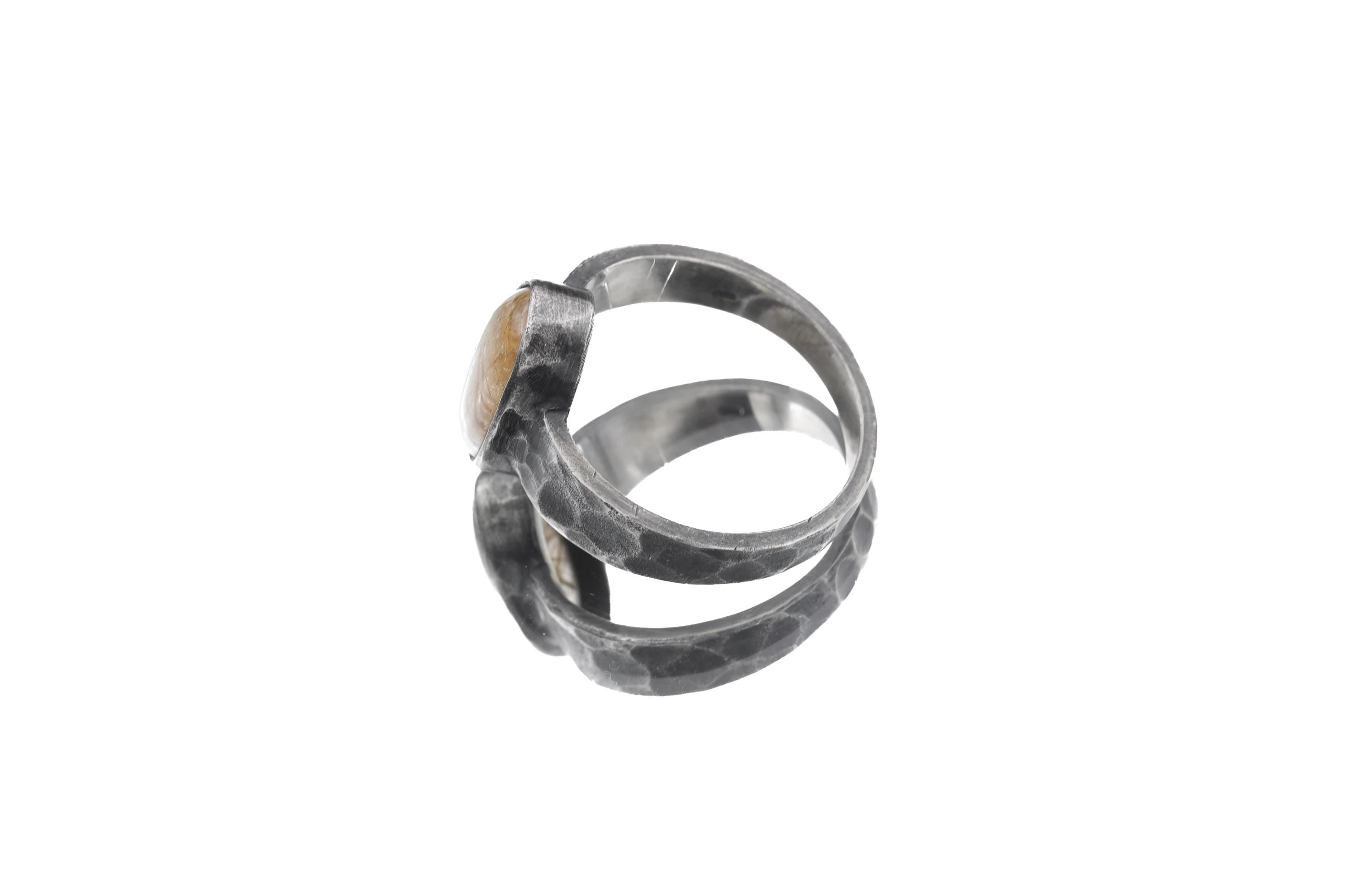 Side view of Gold Rutilated Clear Quartz ring showing raised bezel, hammered texture, and medium-wide silver band.