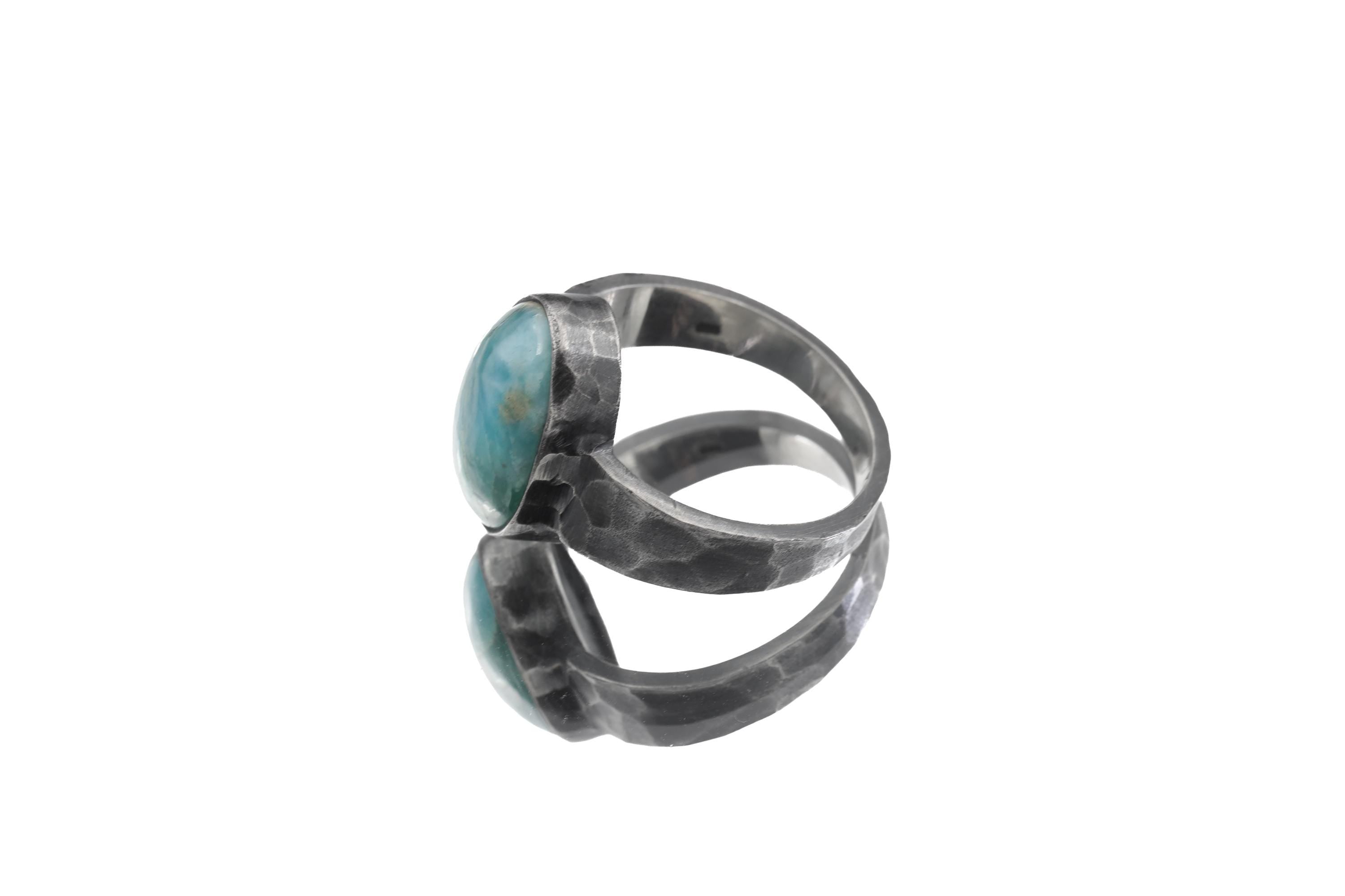 Side view of Larimar men’s ring showing oxidized 925 silver, medium-width hammered band, and stone-forward setting.