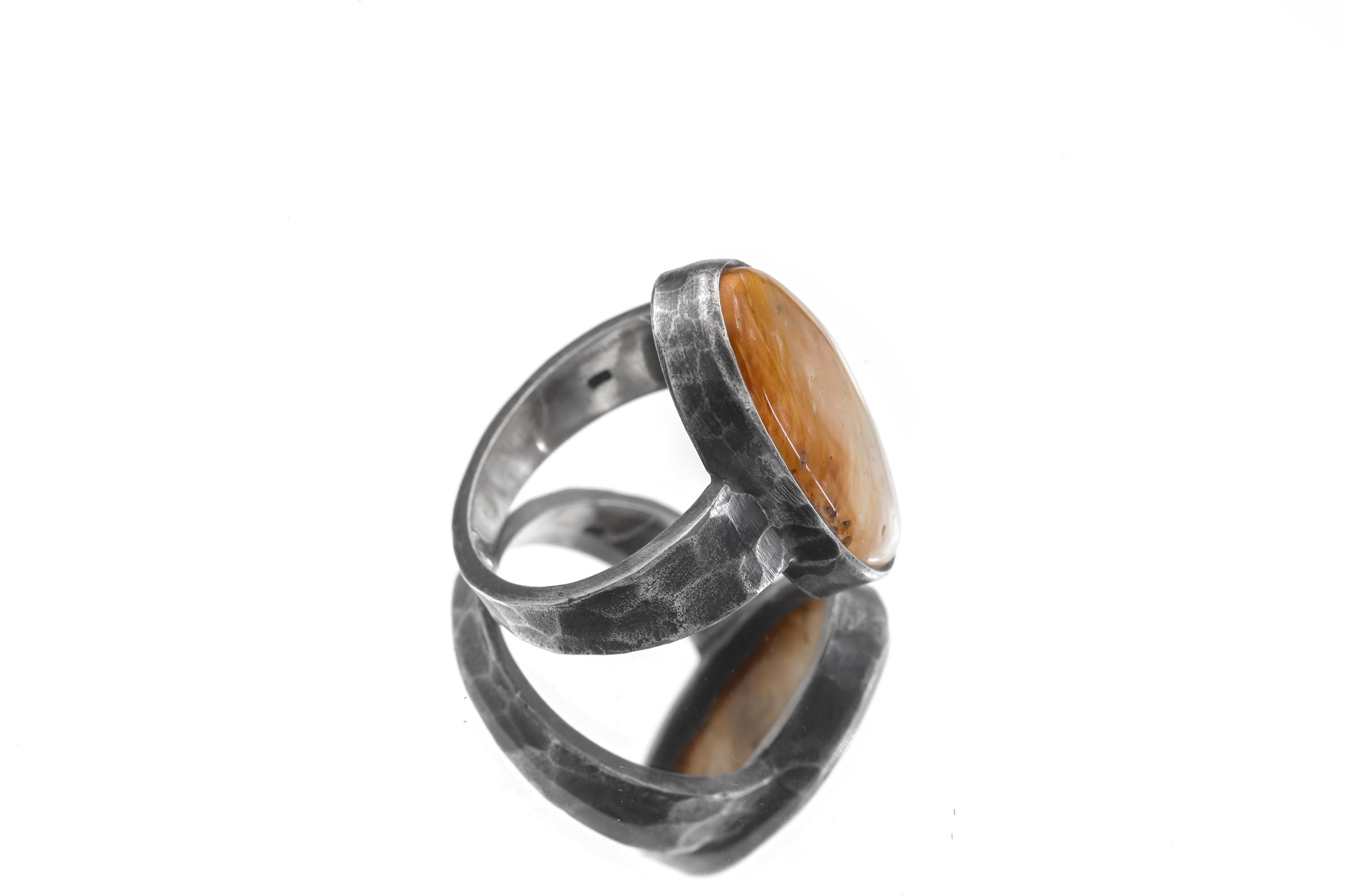 Side view of Gold Rutilated Quartz sterling silver ring showing hammered band and raised oval bezel.