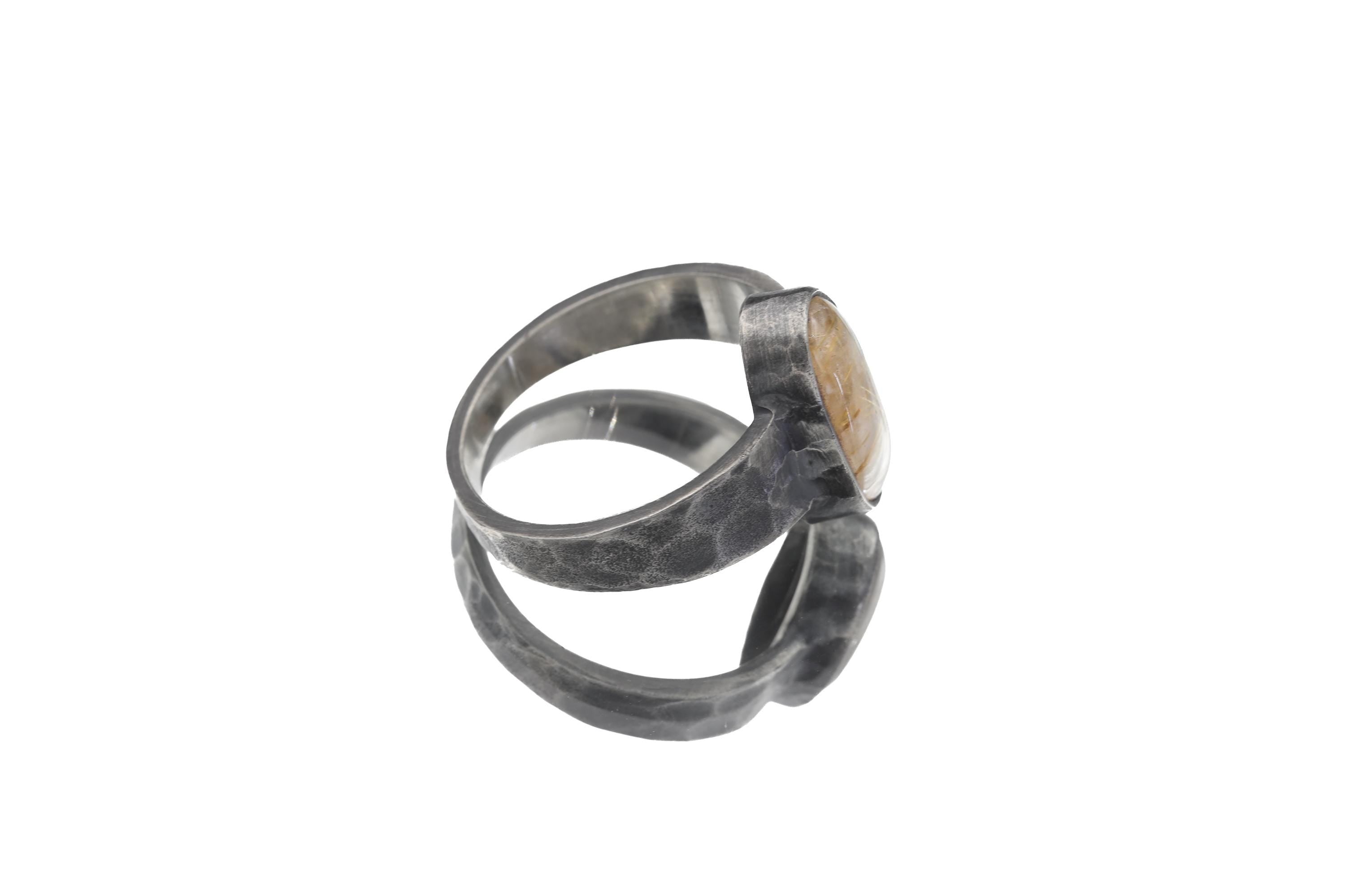 Side view of Gold Rutilated Clear Quartz ring showing raised bezel, hammered texture, and medium-wide silver band.
