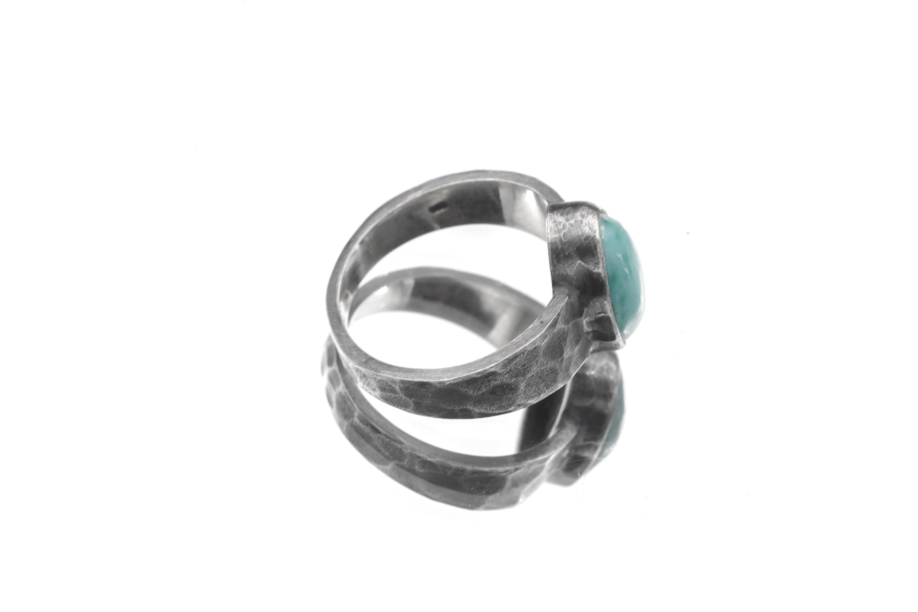 Side view of Larimar men’s ring showing oxidized 925 silver, thick bezel setting, and rugged hammered band.