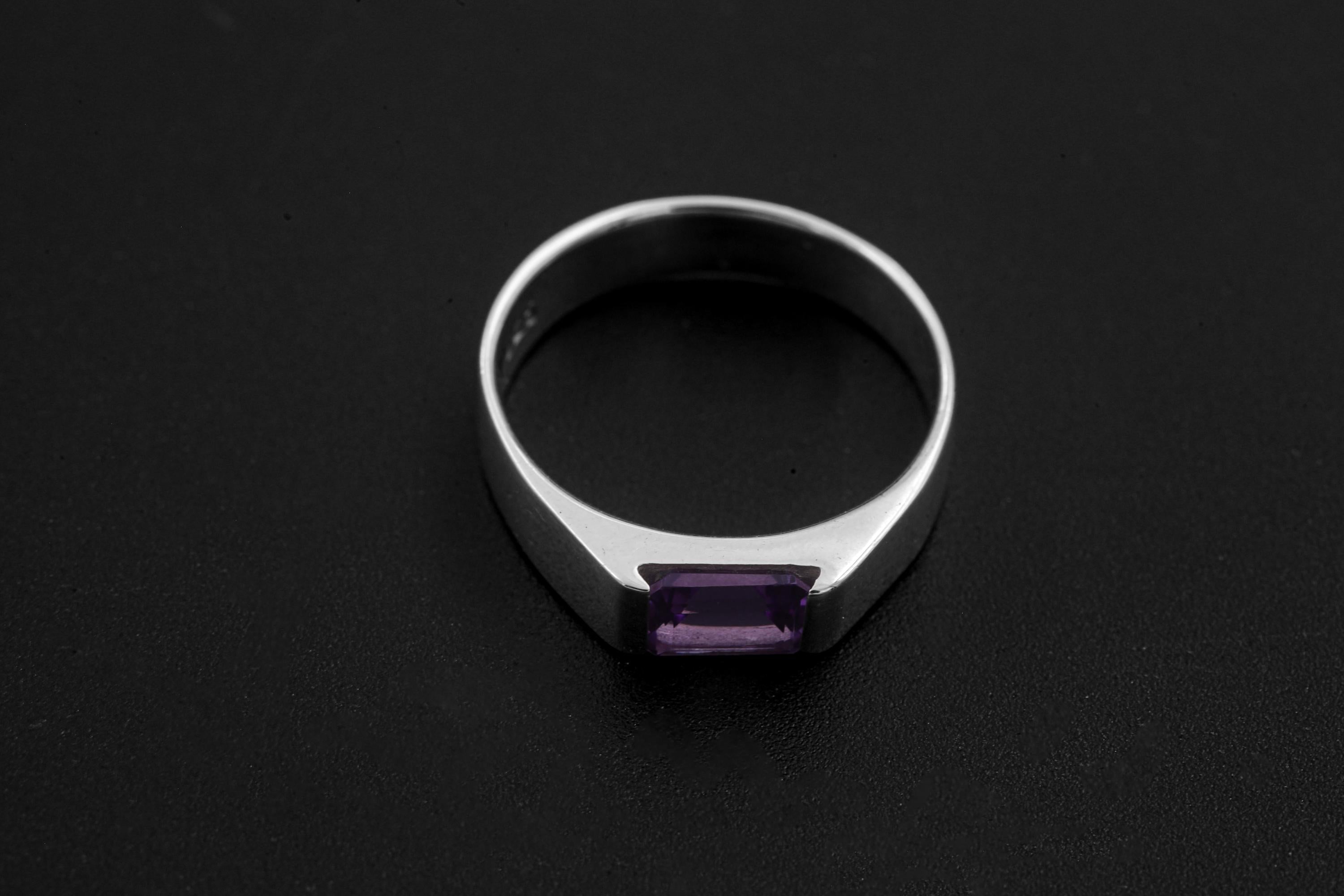 Octagon Amethyst ring displayed on dark background with polished sterling silver band.