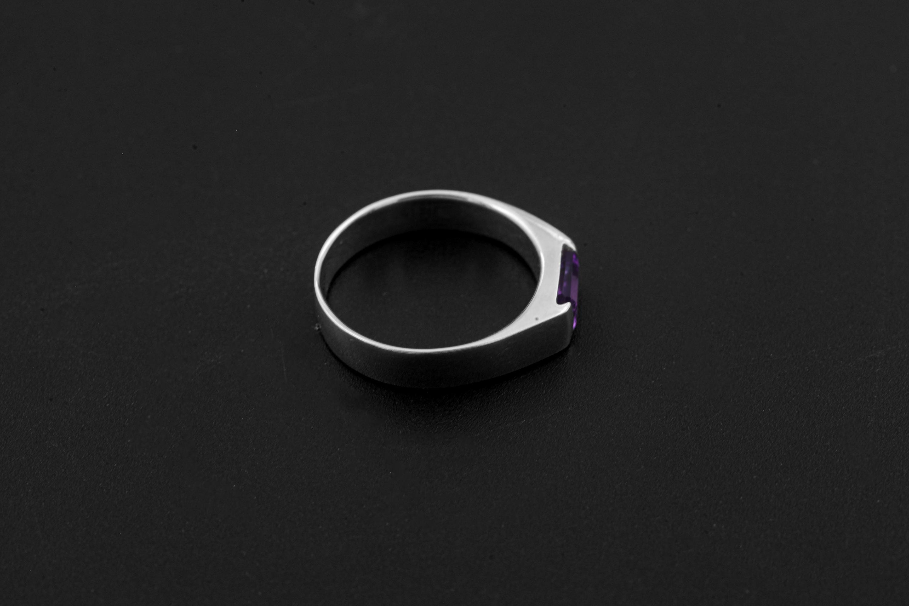 Octagon Amethyst ring displayed on dark background with polished sterling silver band.