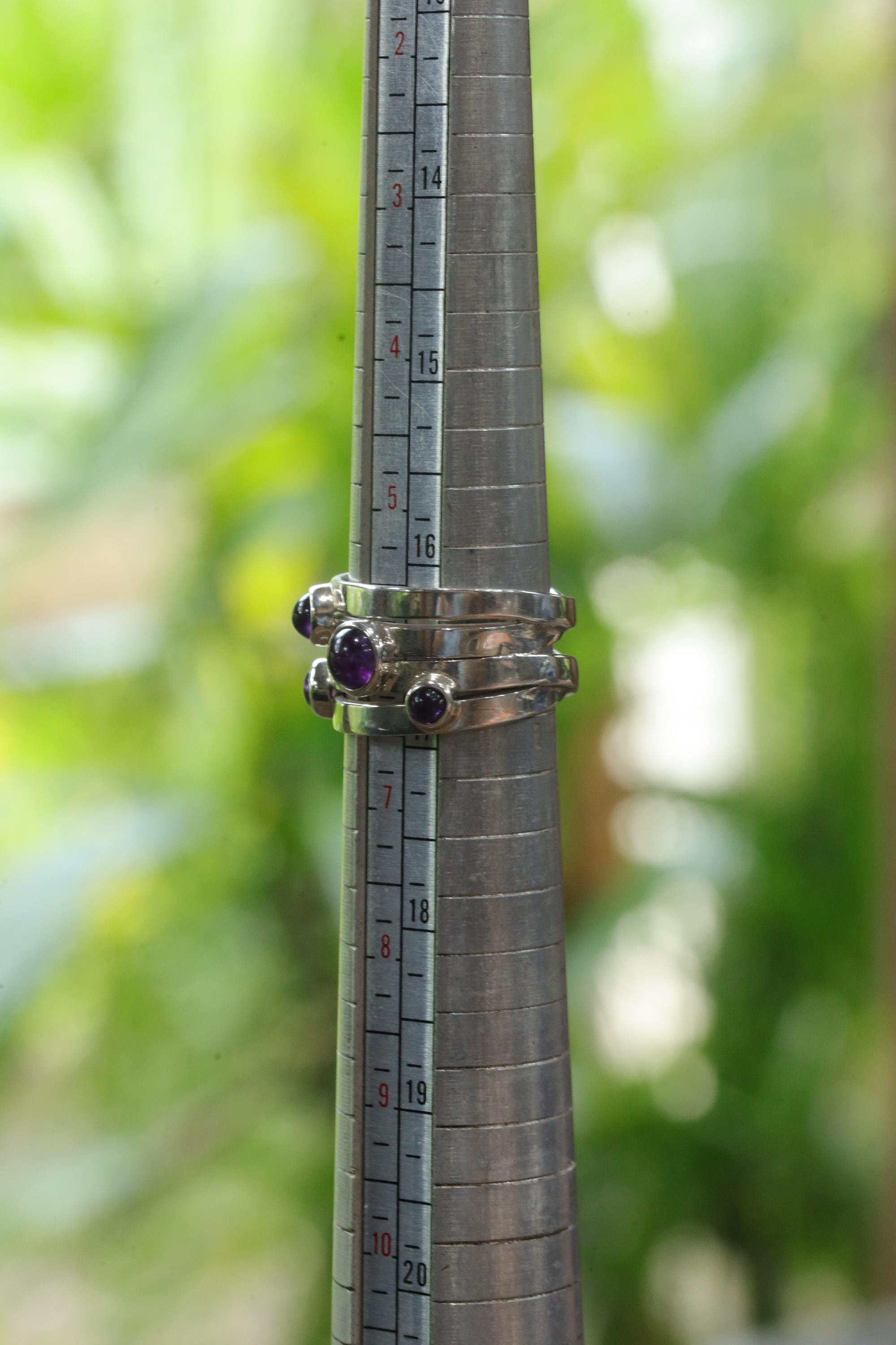 Five stone Amethyst sterling silver ring shown on mandrel for US size 6 reference.