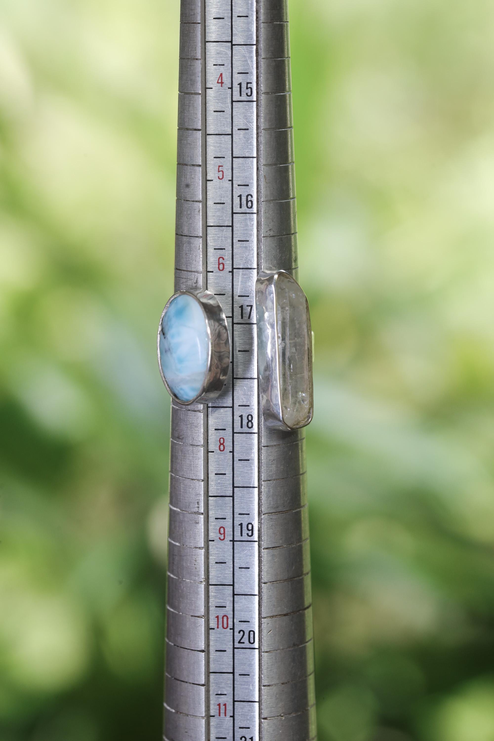 Horizon Flow Quartz and Larimar Ring shown beside a ruler for scale with adjustable sterling silver open band.
